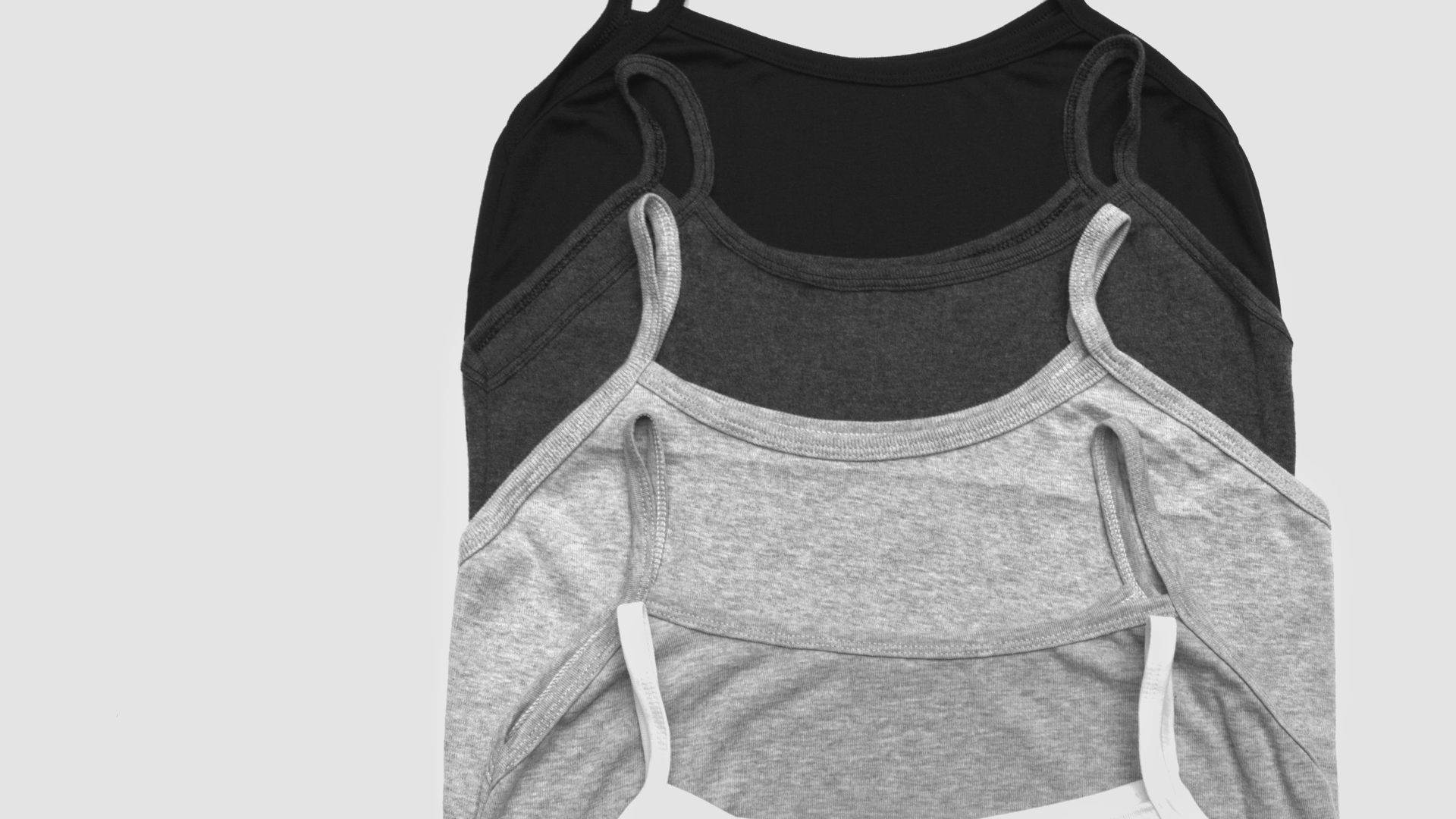 grayscale photos of five camisoles