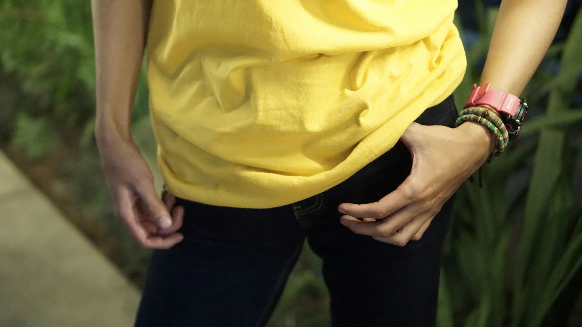 person in yellow shirt and black pants