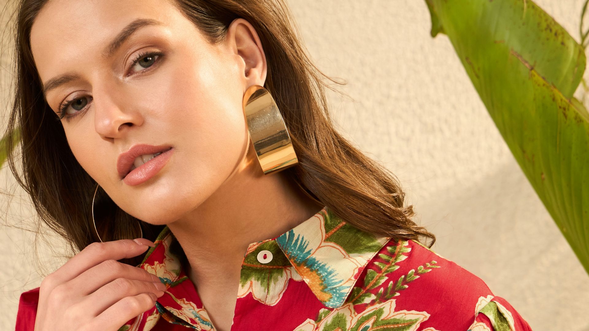 Woman in a vibrant red floral print dress