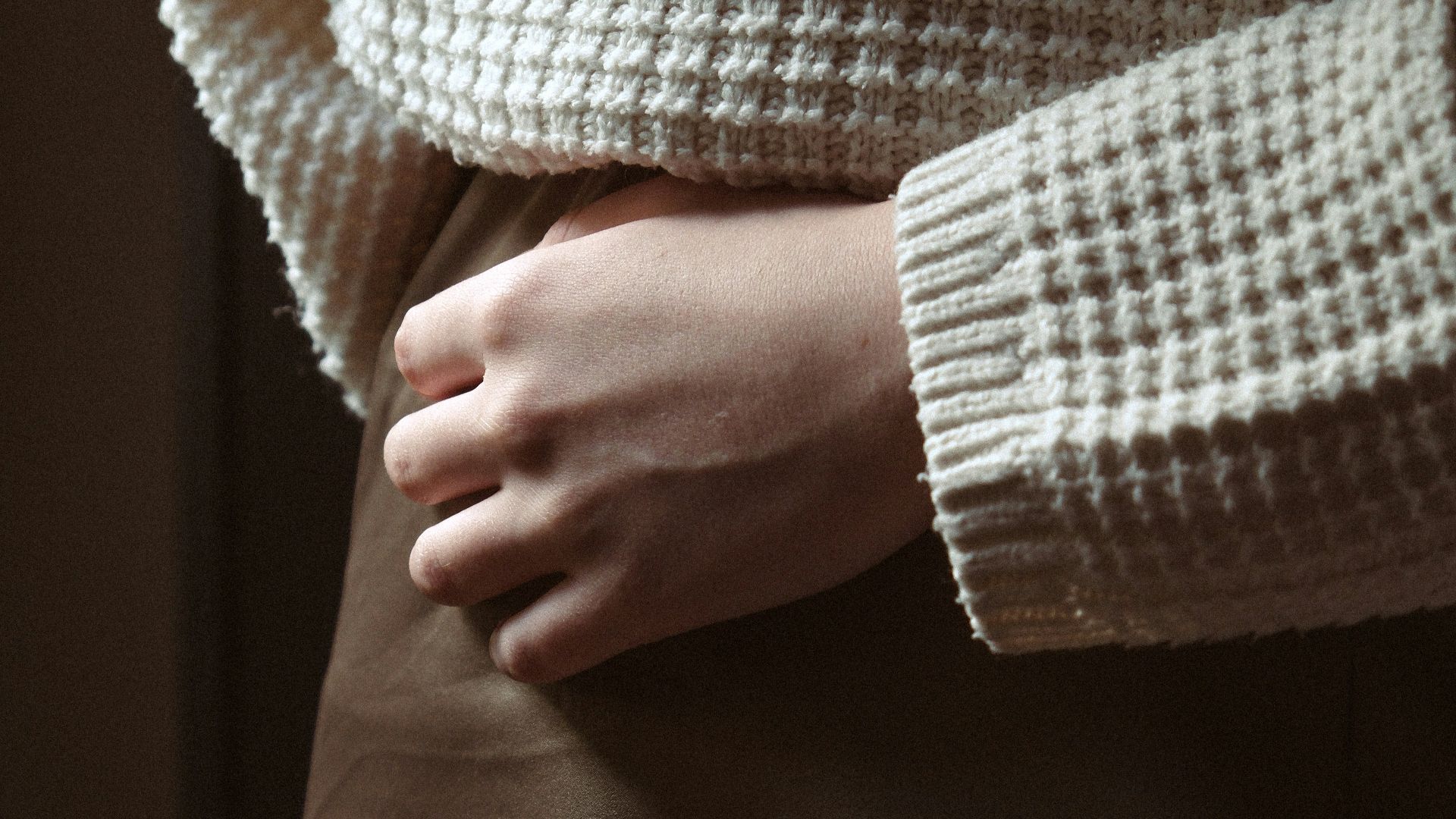 a close up of a person wearing a skirt