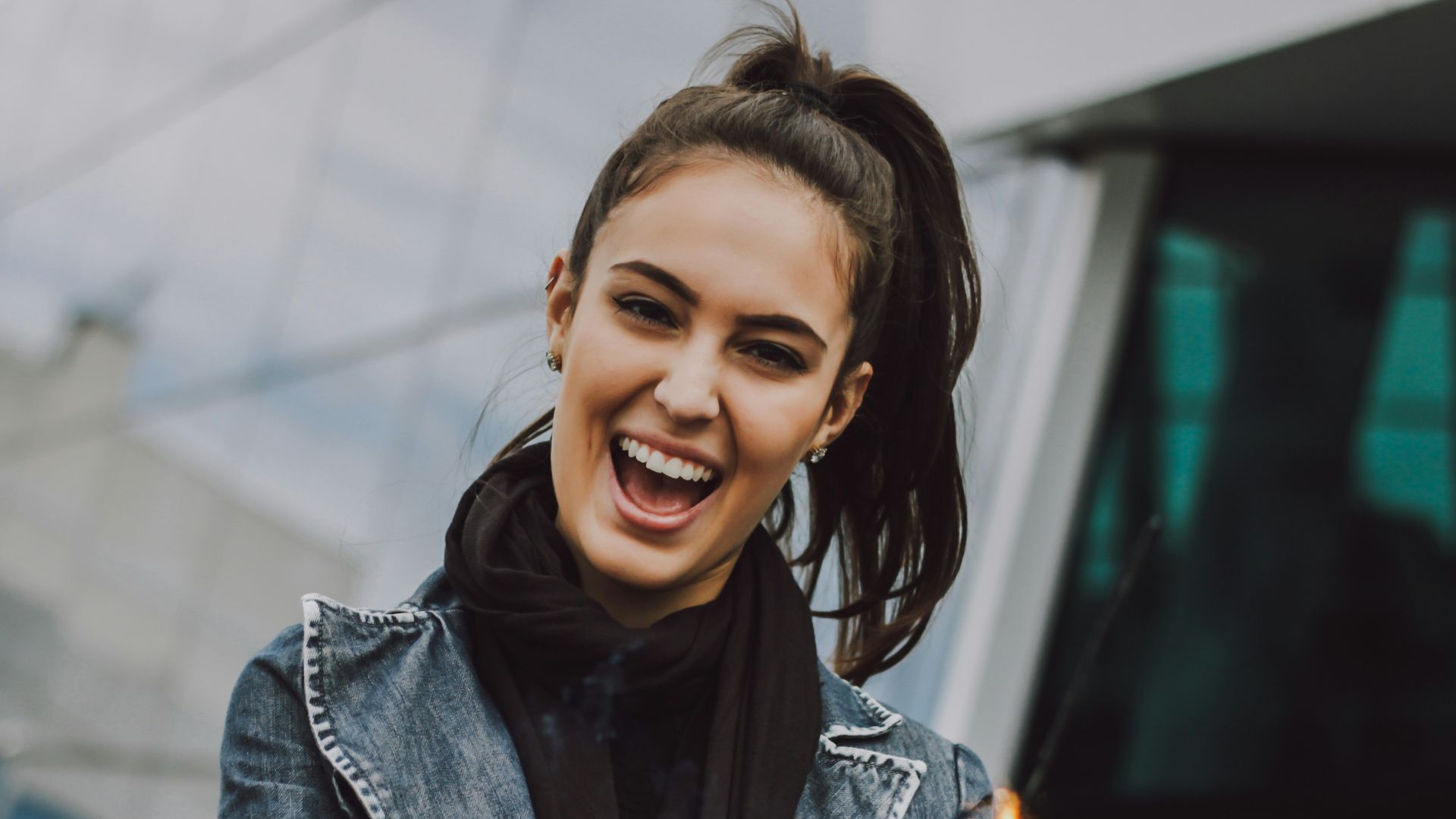 woman wearing gray denim jacket and black scarf