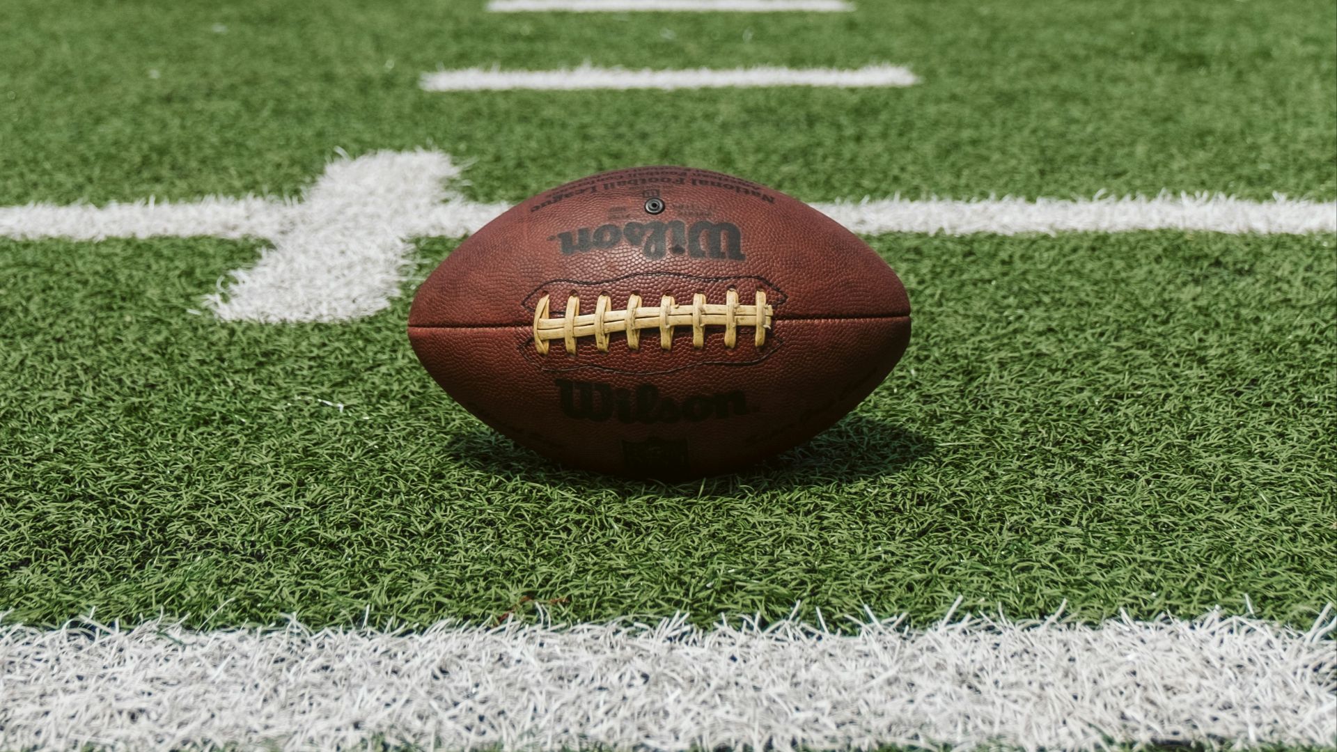 brown and black Wilson football
