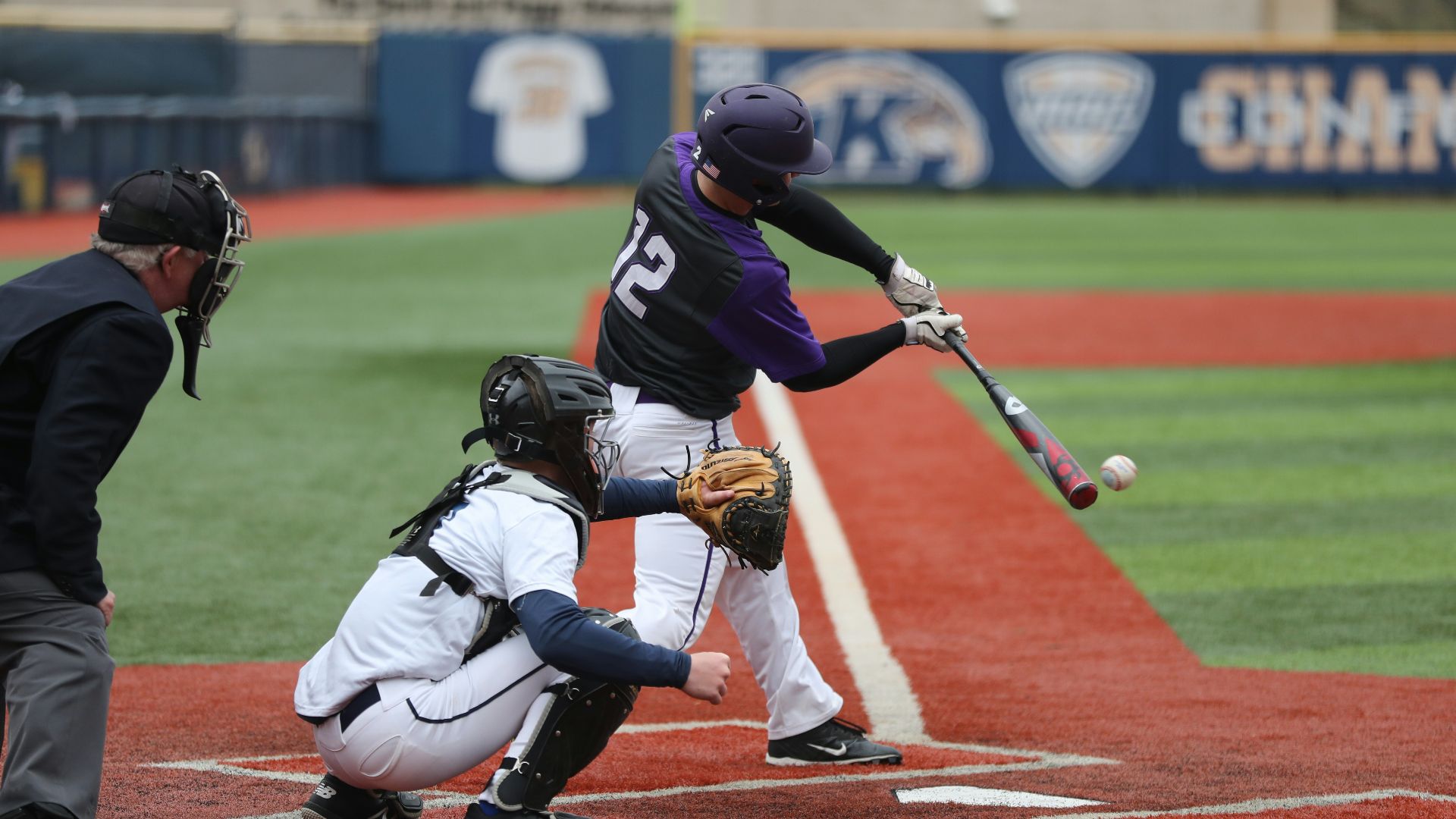 baseball player swinging bat
