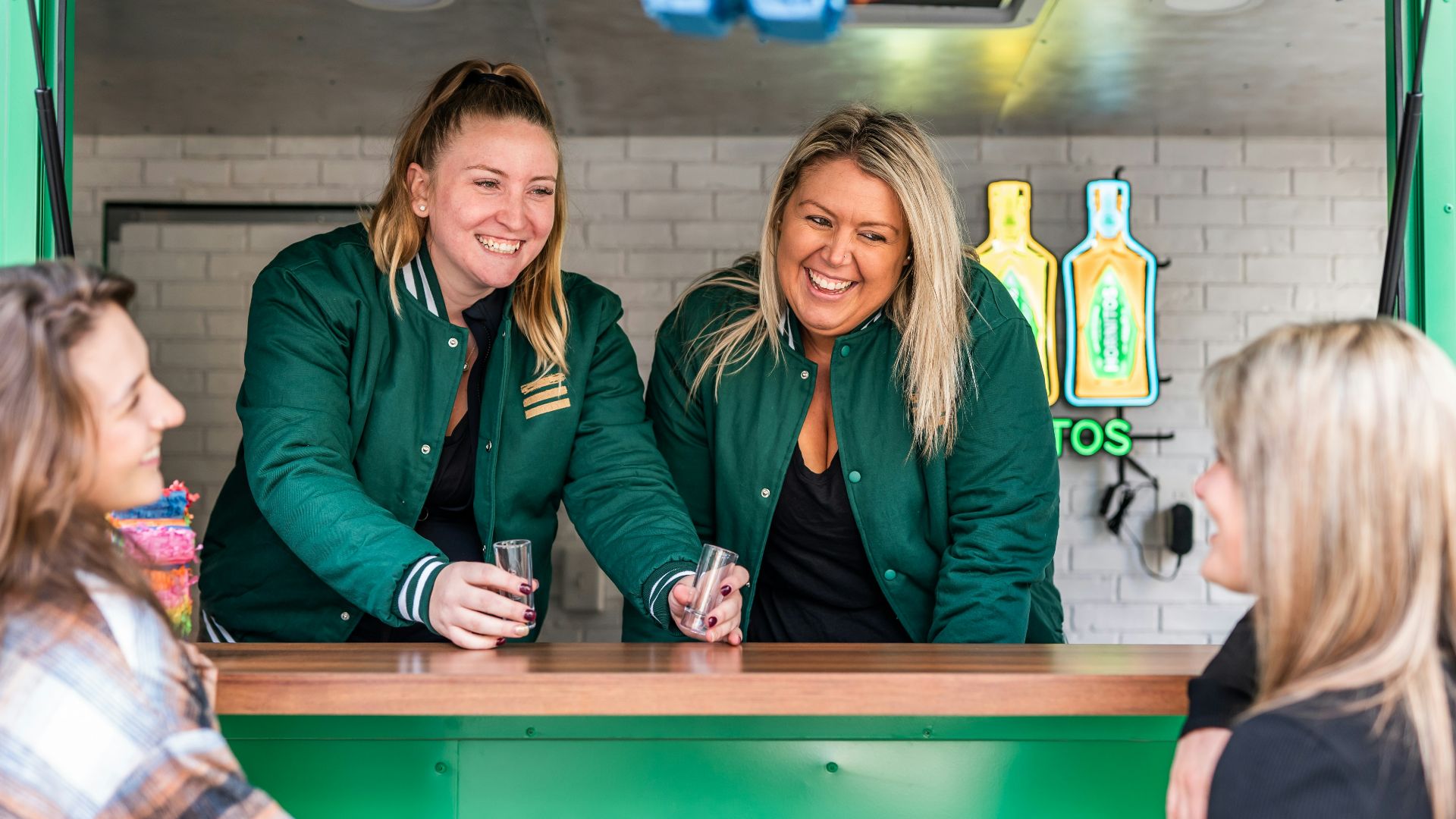 a few women sitting at a table