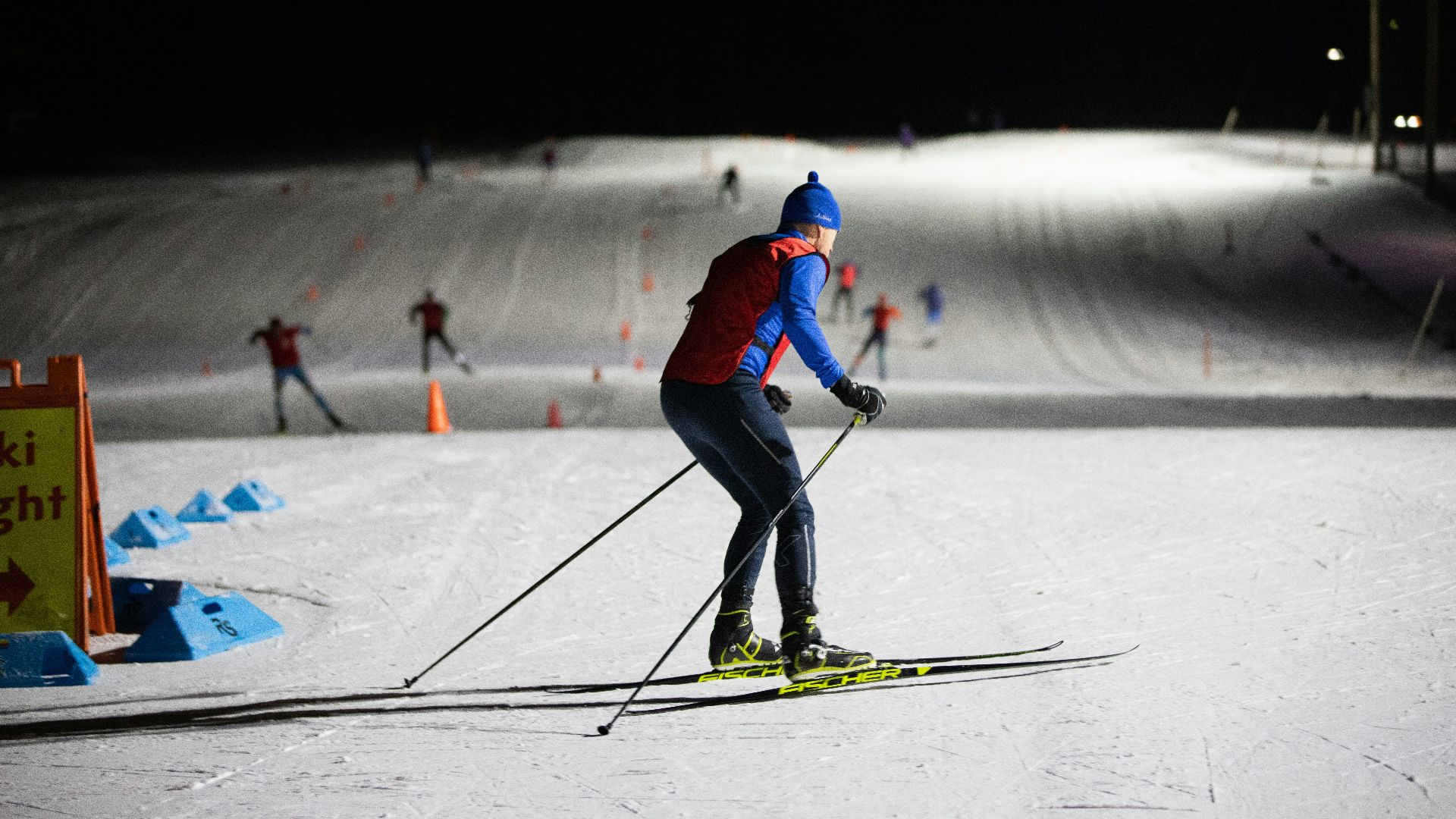 a man riding skis down a snow covered slope