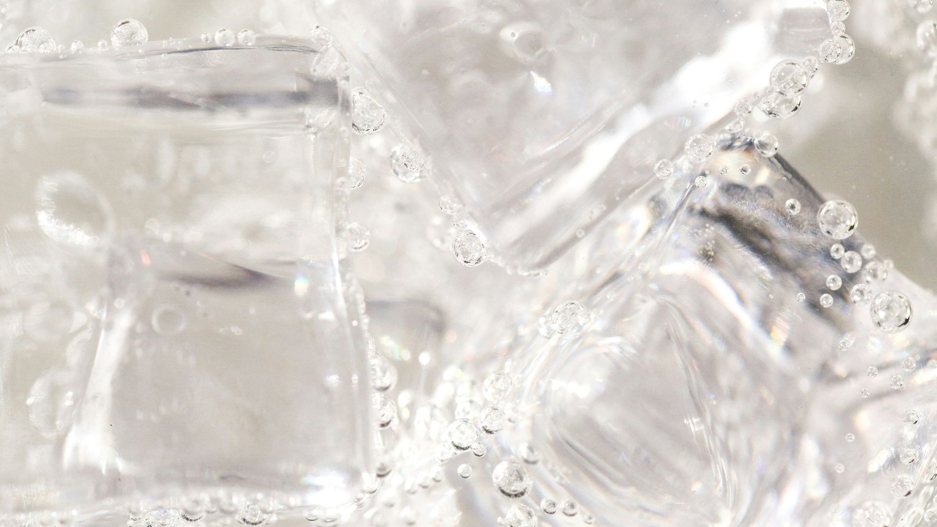 clear glass container on white textile