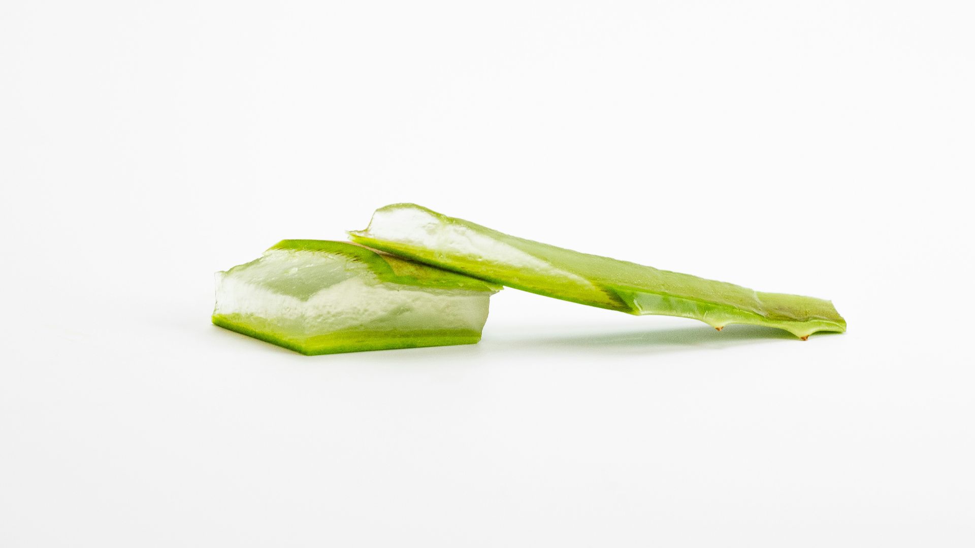 a piece of celery sitting on top of a white surface