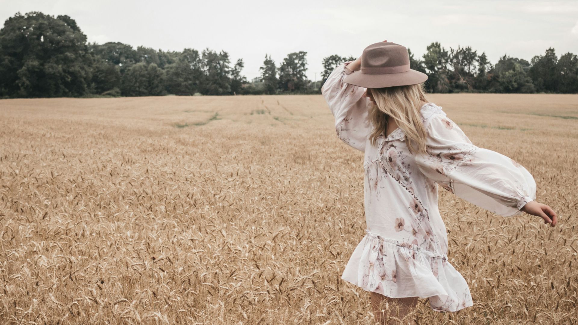 woman wearing white and pink floral long-sleeved shirt