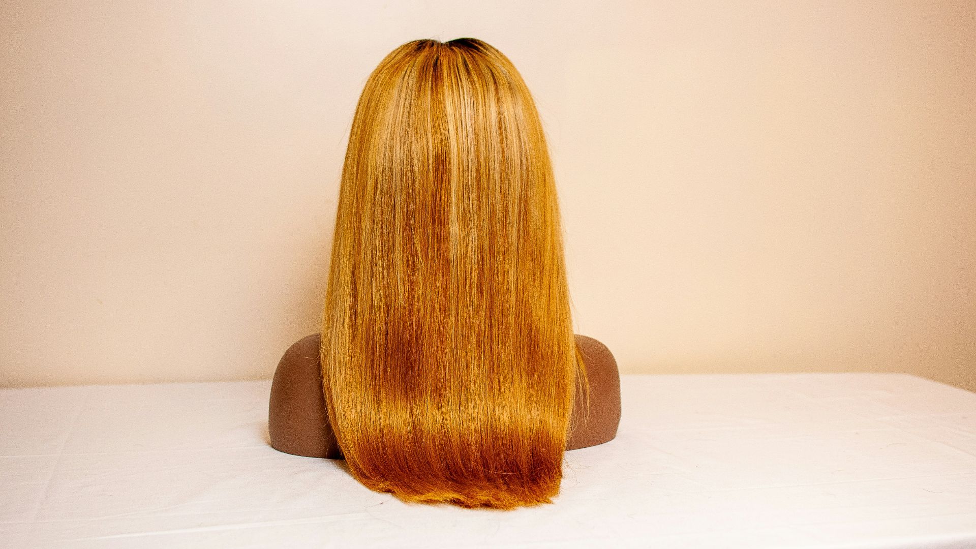 a woman's head on a white surface