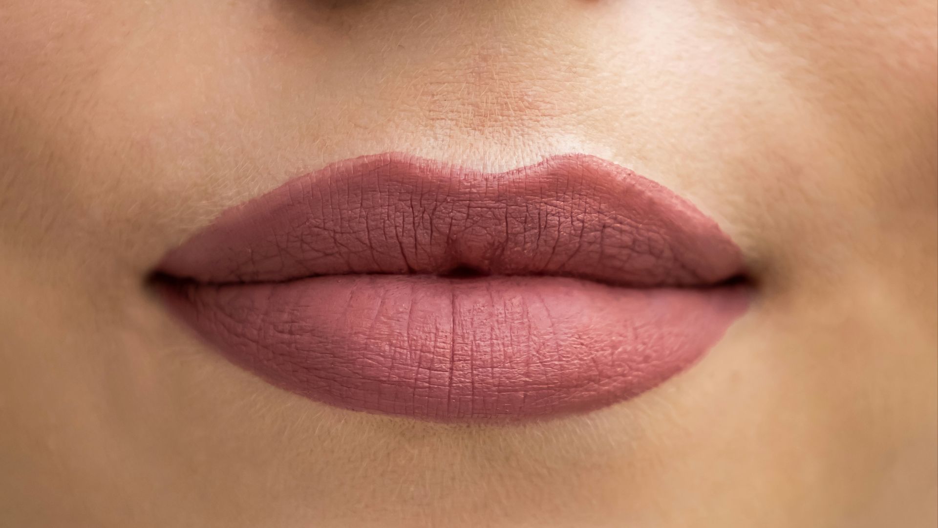 a close up of a woman's lips and nose