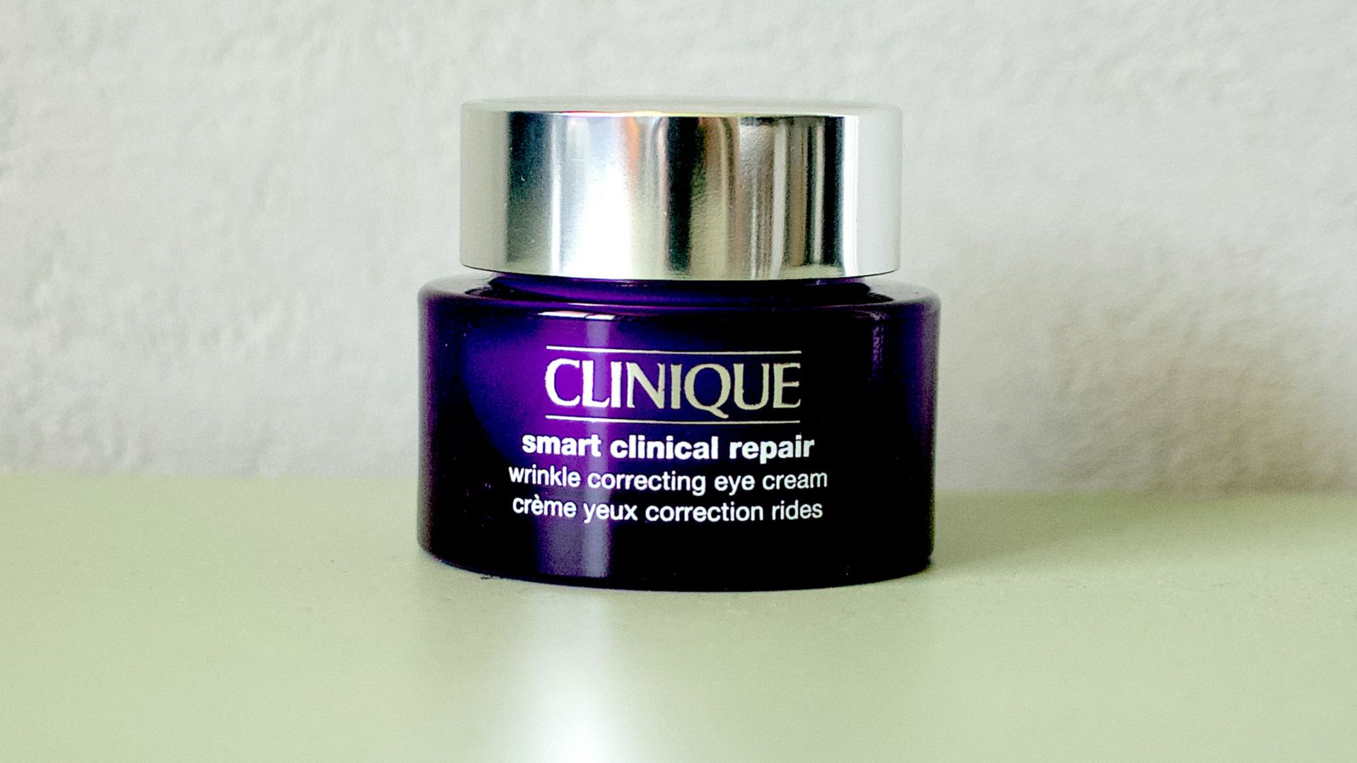 a bottle of clinique on a table