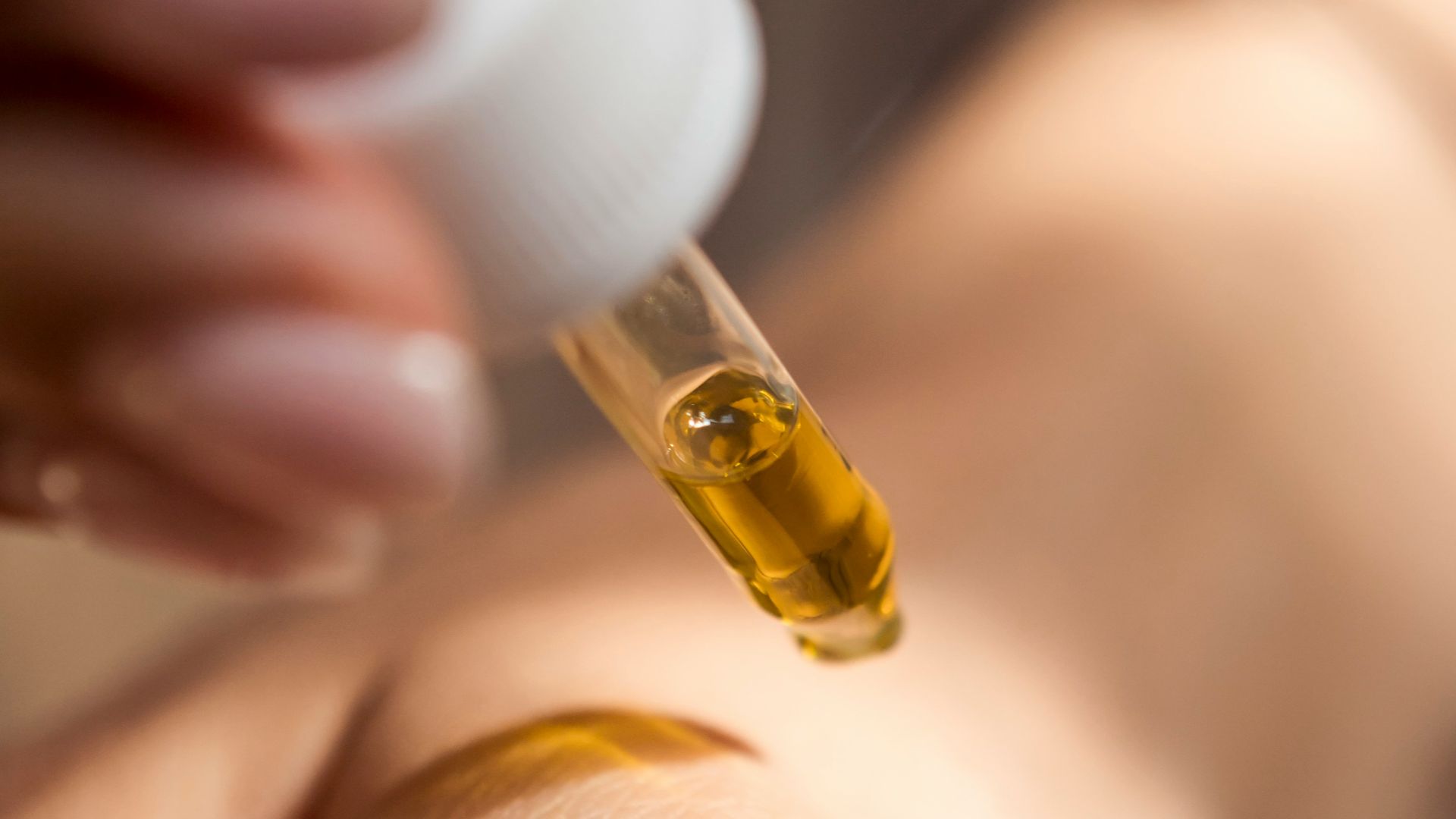 person holding dropper