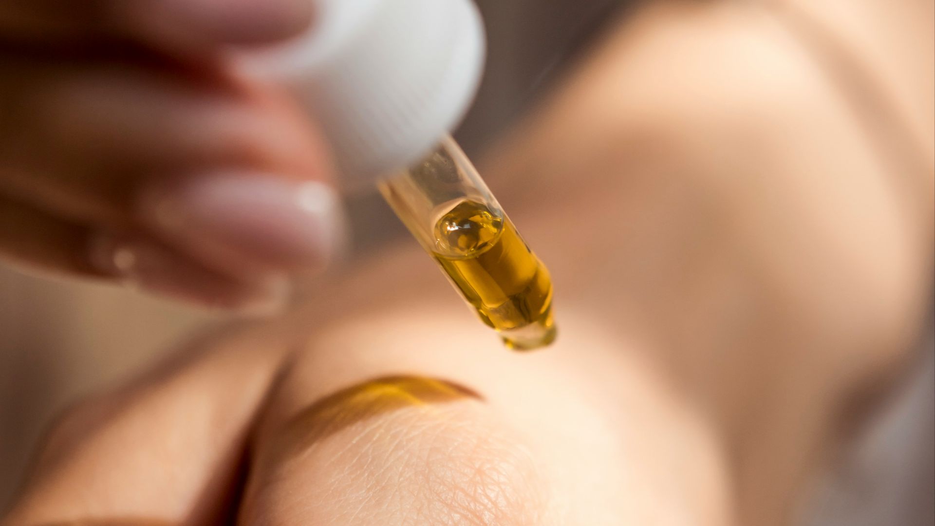 person holding dropper