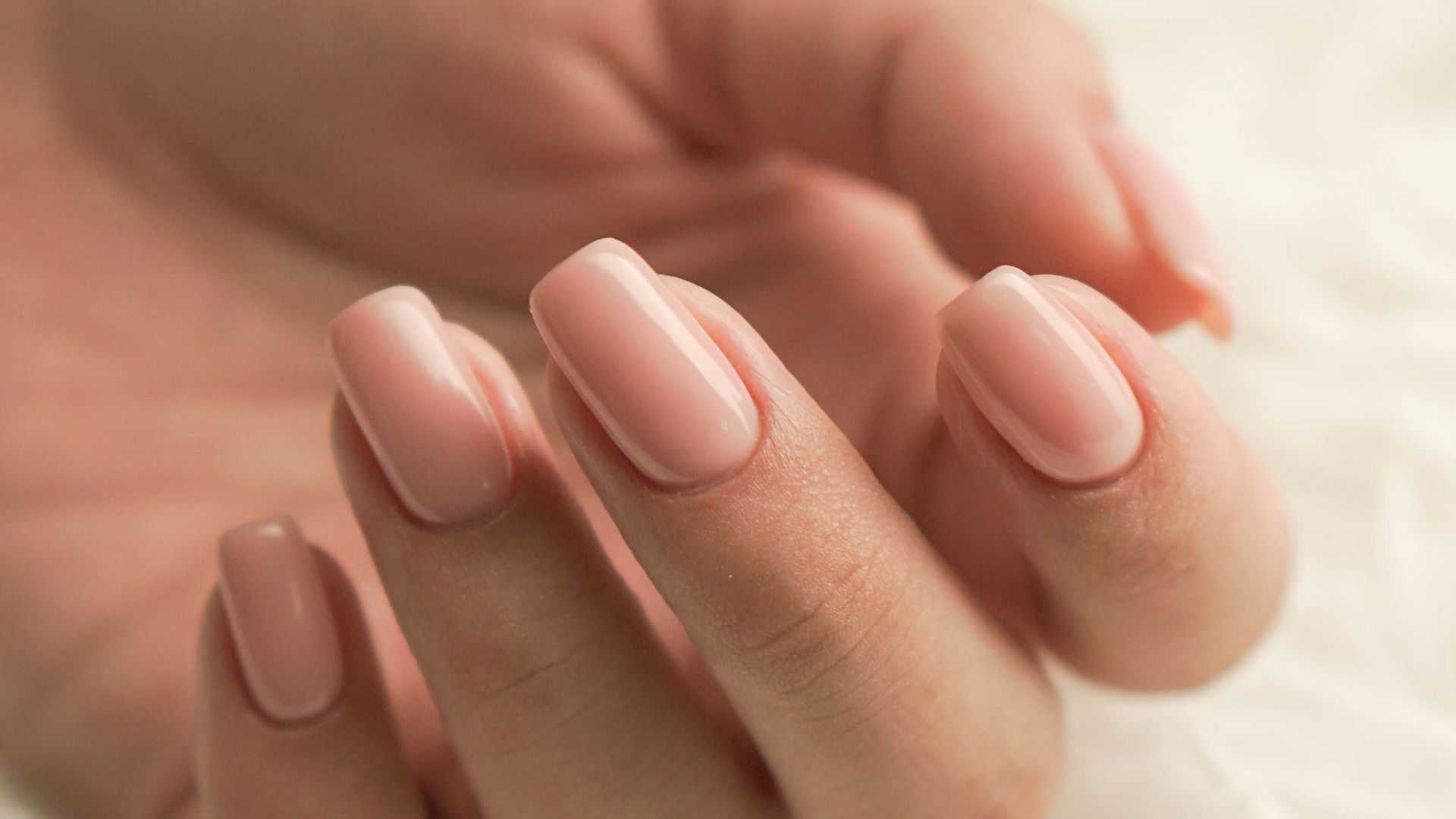 persons feet on white textile