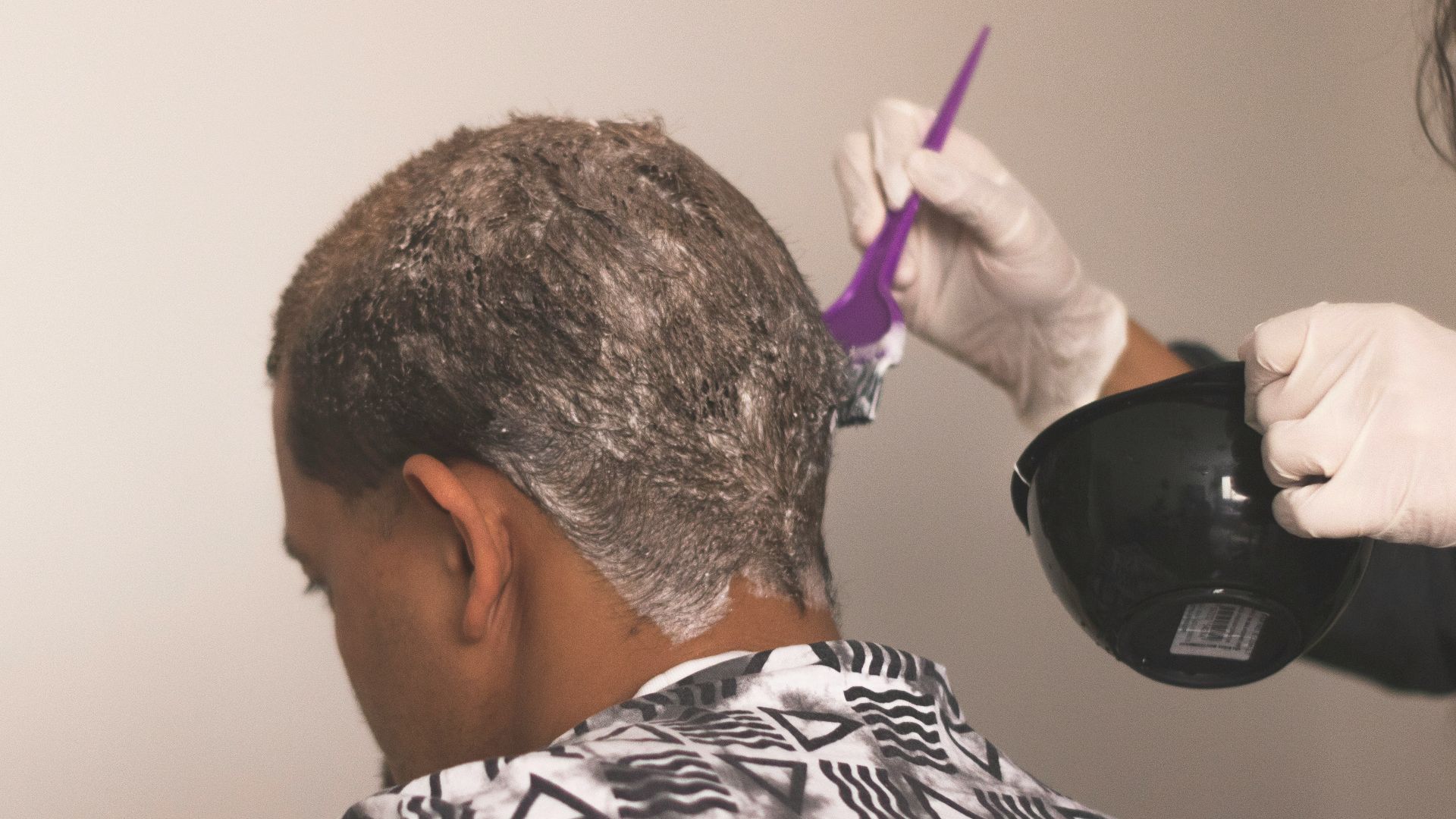 man in black and white stripe shirt wearing black headphones