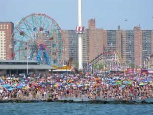 1280px-Coney_Island_beach_on_Memorial_Day-300x225.jpg