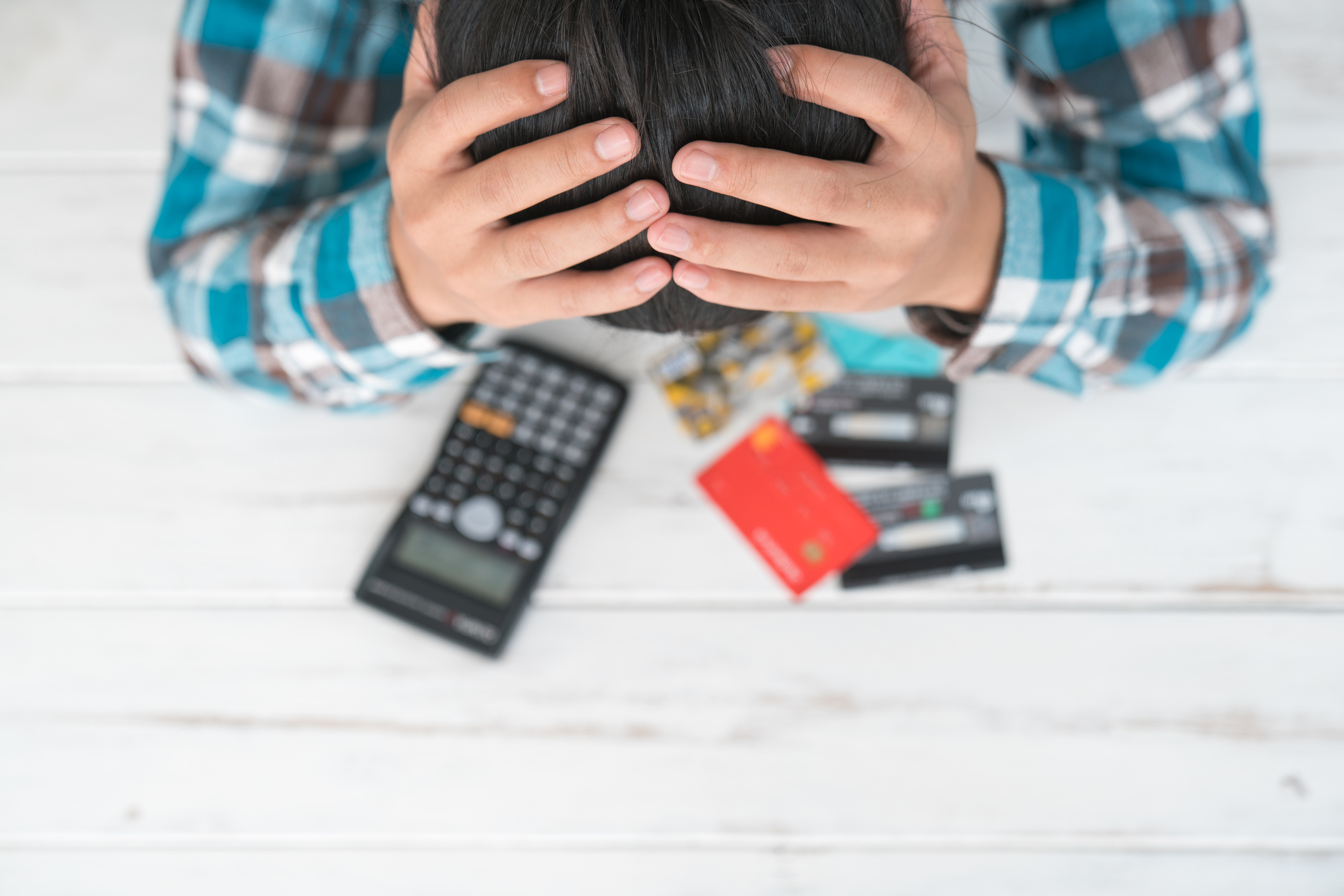 The man is stressed with debt owed by using credit card