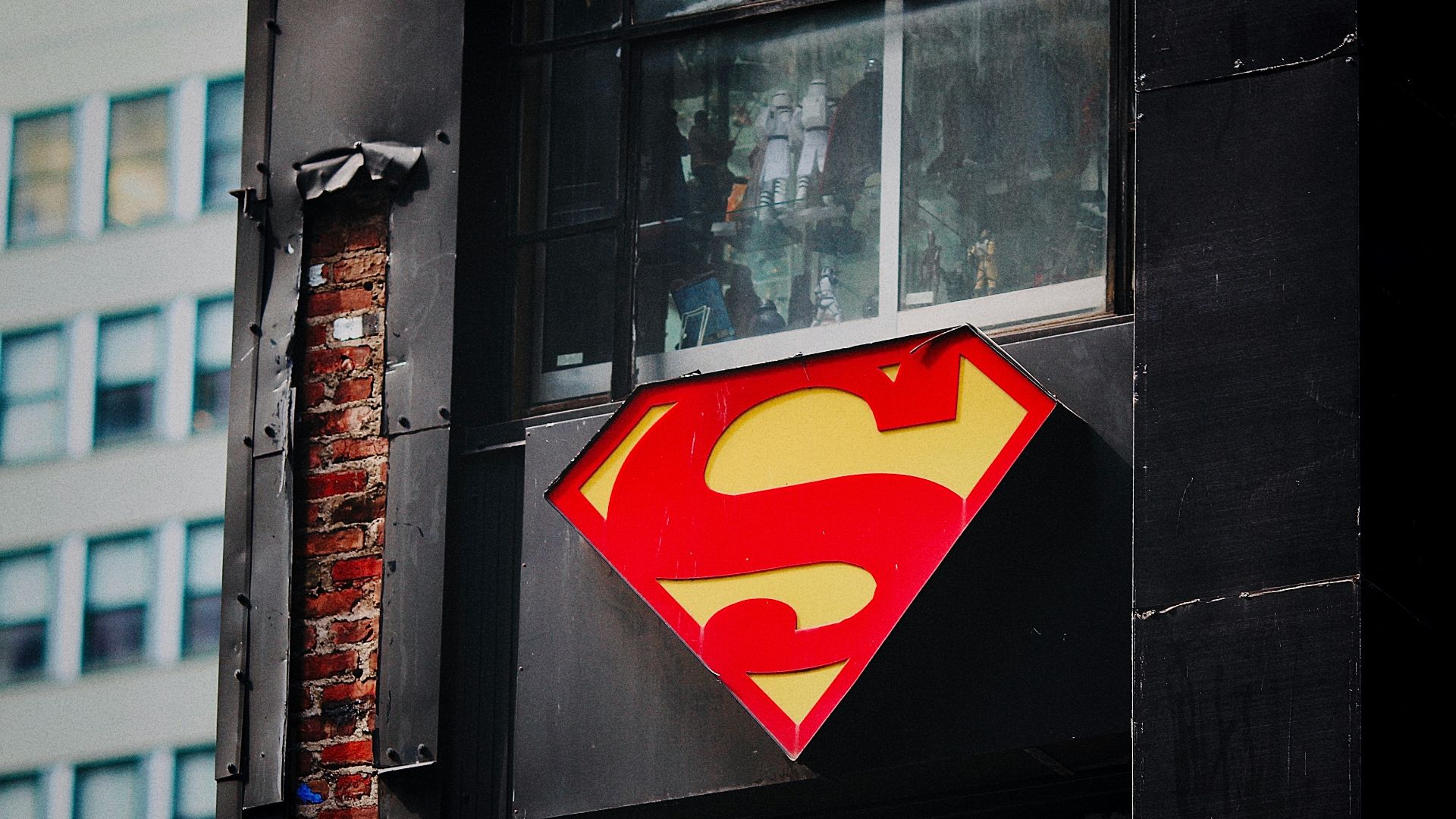 red and yellow heart sticker on black wooden door