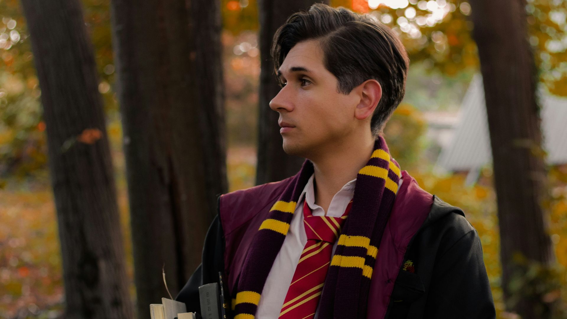 a young man dressed in a harry potter costume