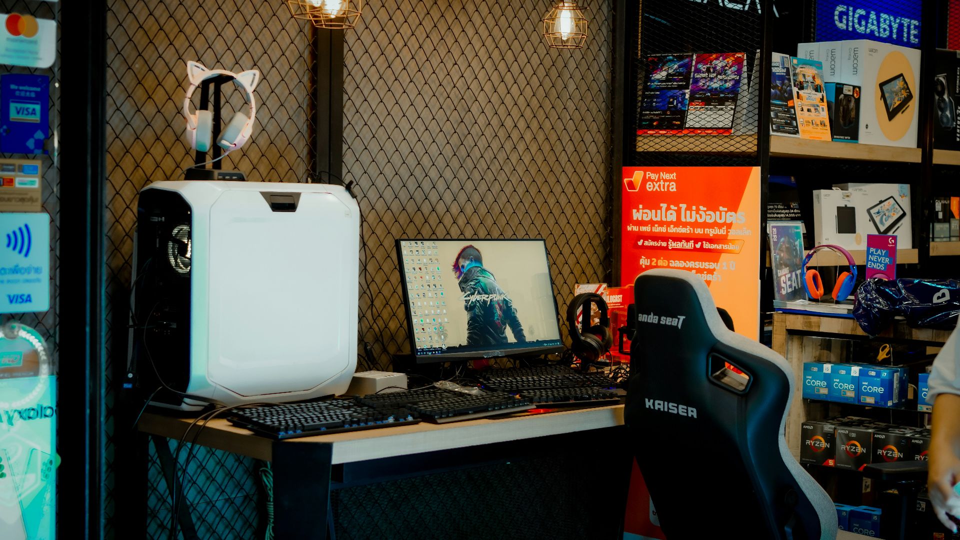 a computer desk with a monitor and a laptop on it