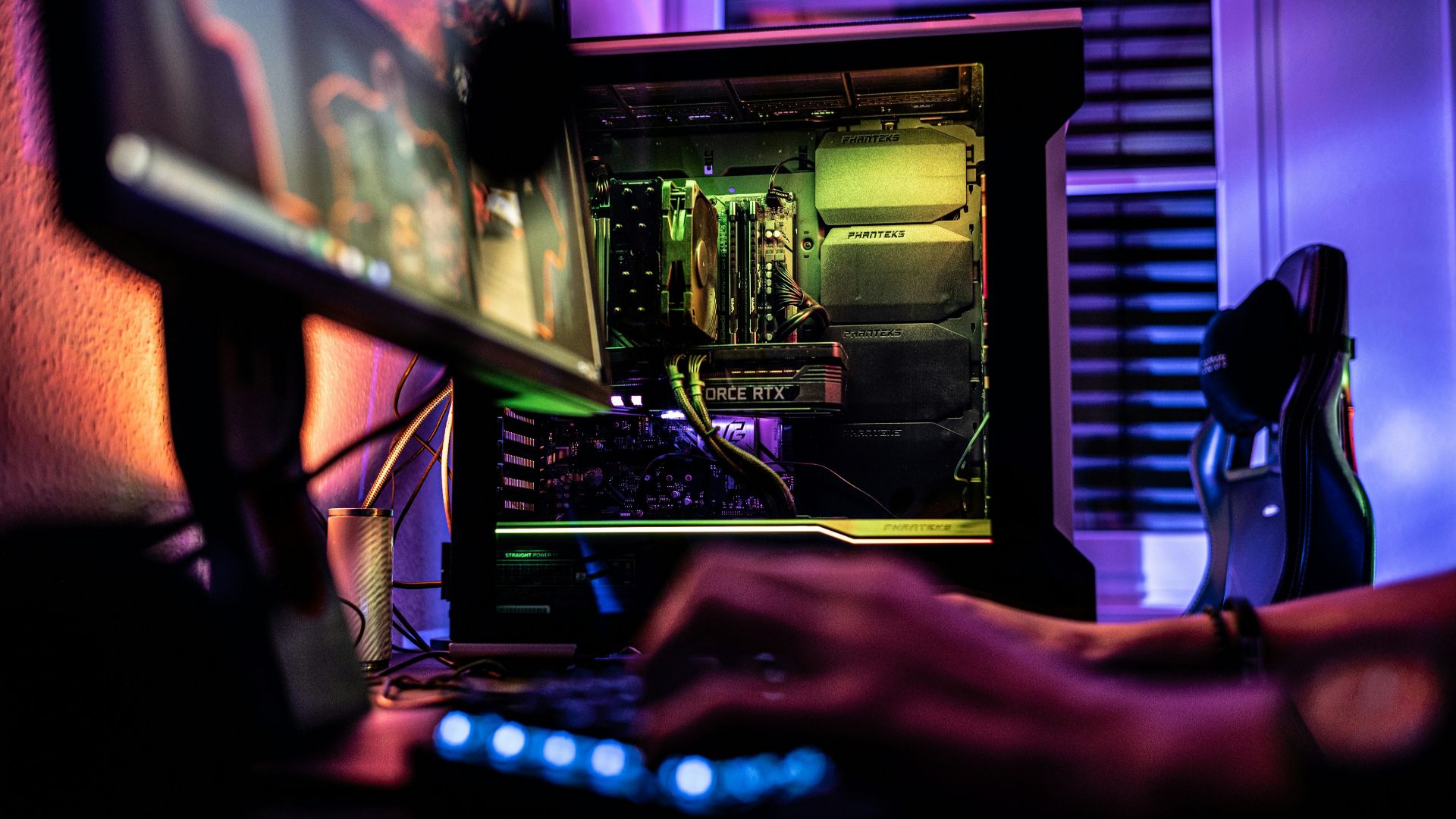 a person working on a computer in a dark room