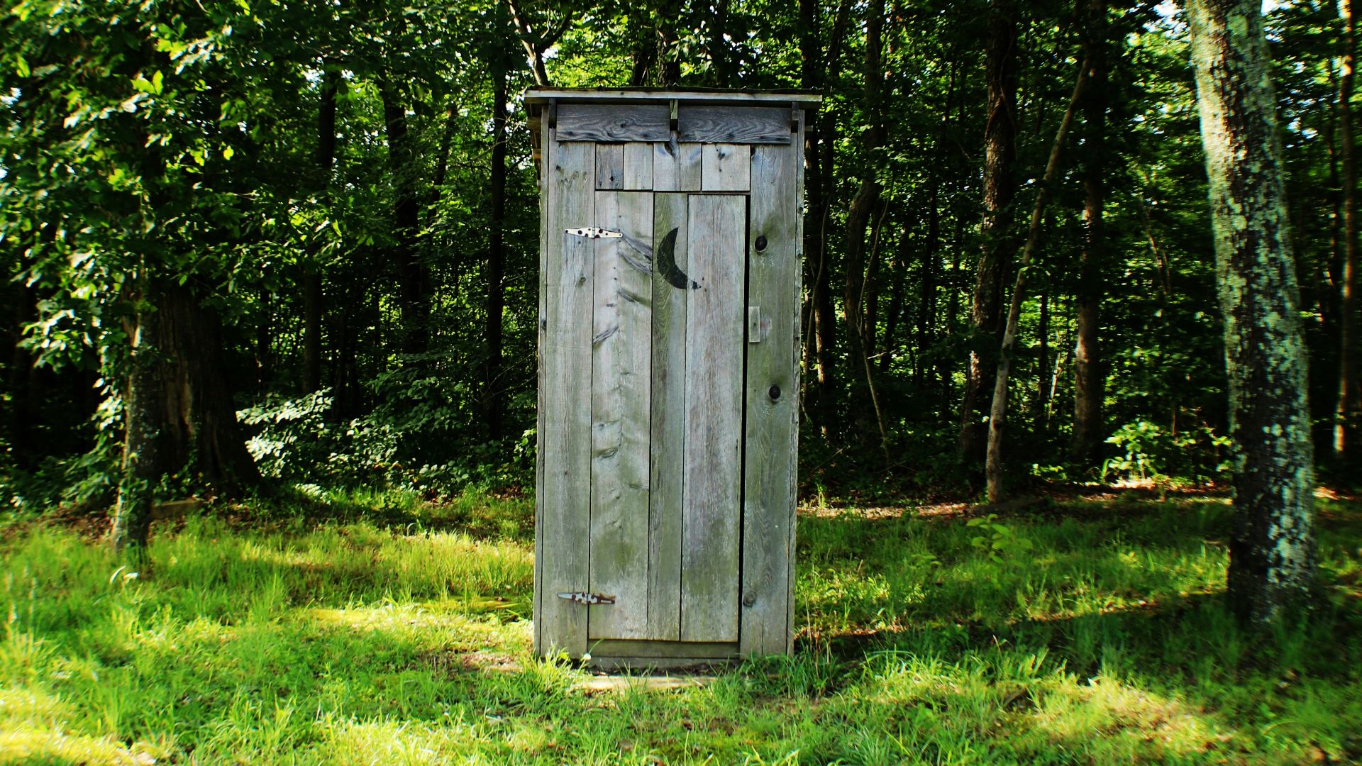 gray wooden outdoor portable bathroom