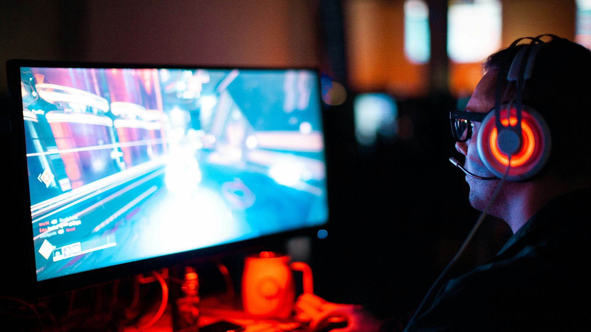 person using computer playing FPS game