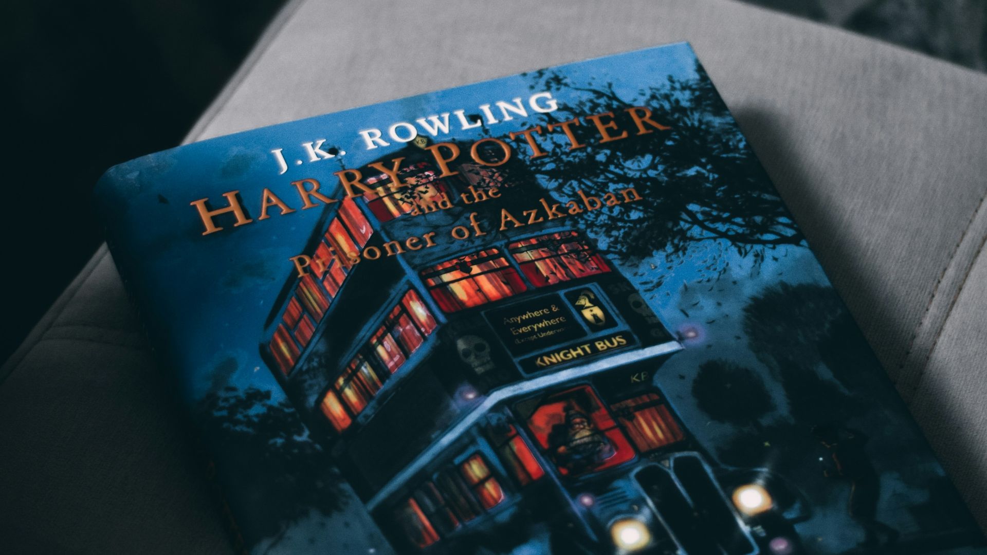 a book sitting on top of a gray couch