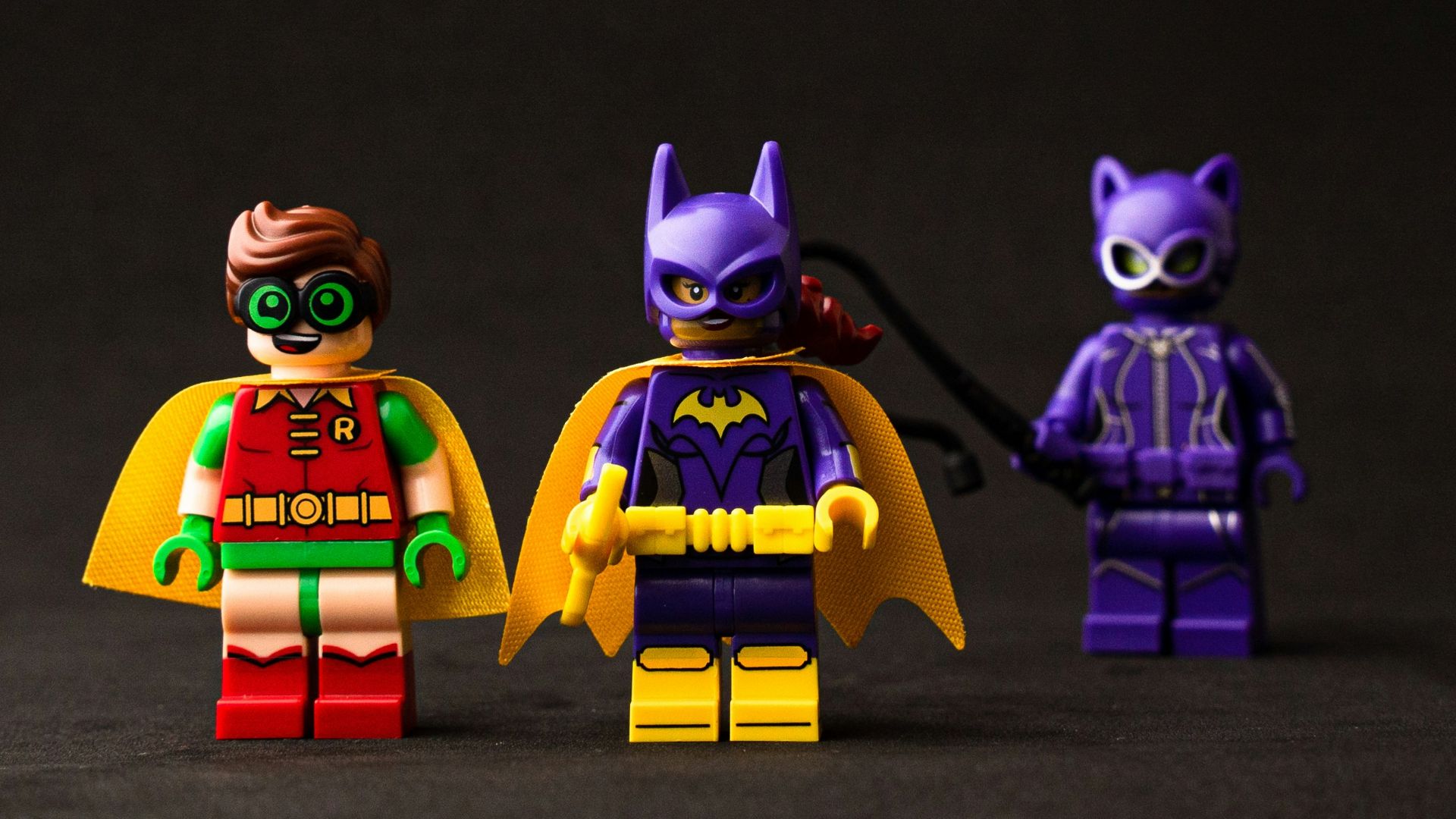 two yellow and purple robot toys