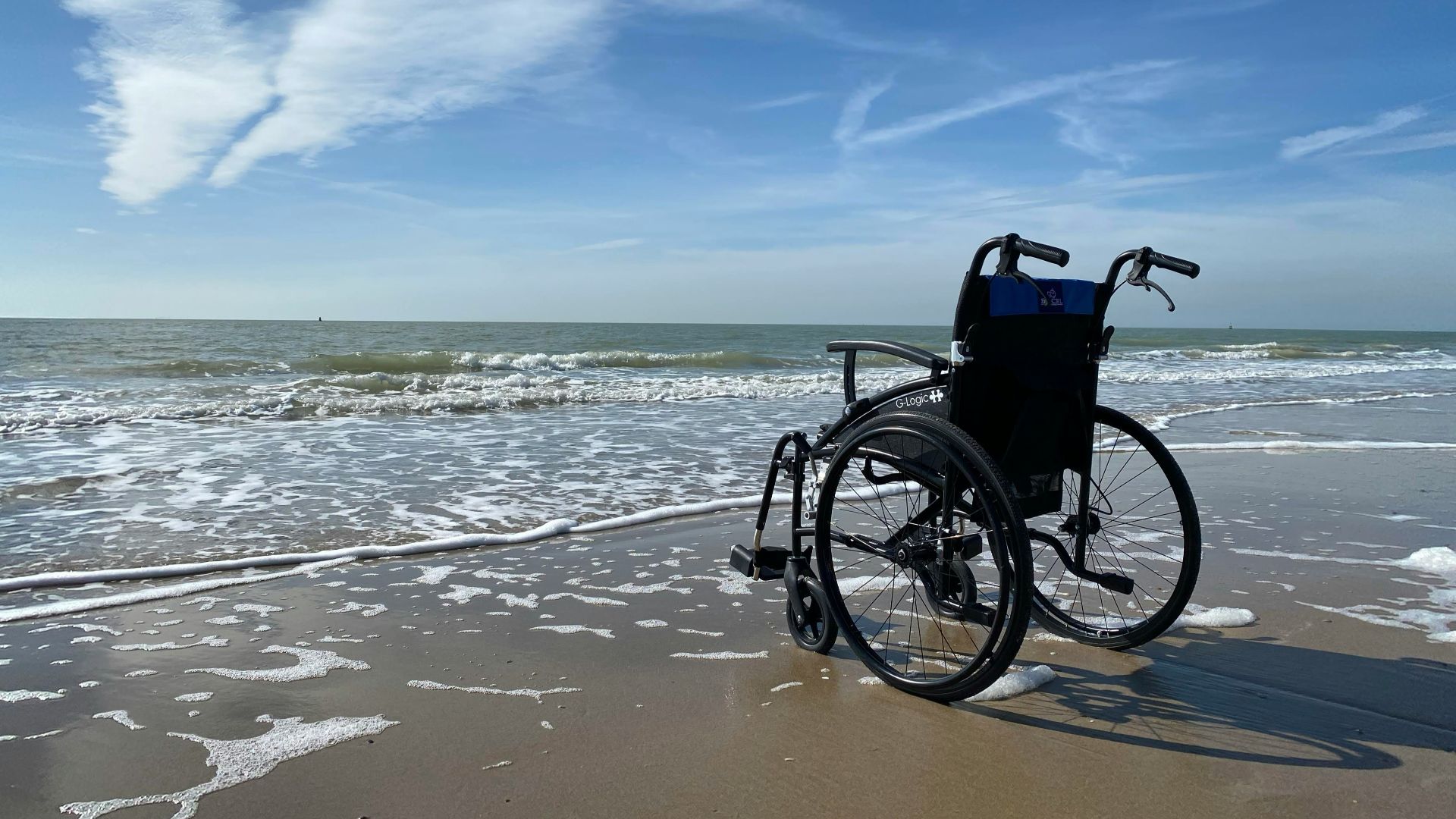 black and gray wheelchair on beach during daytime