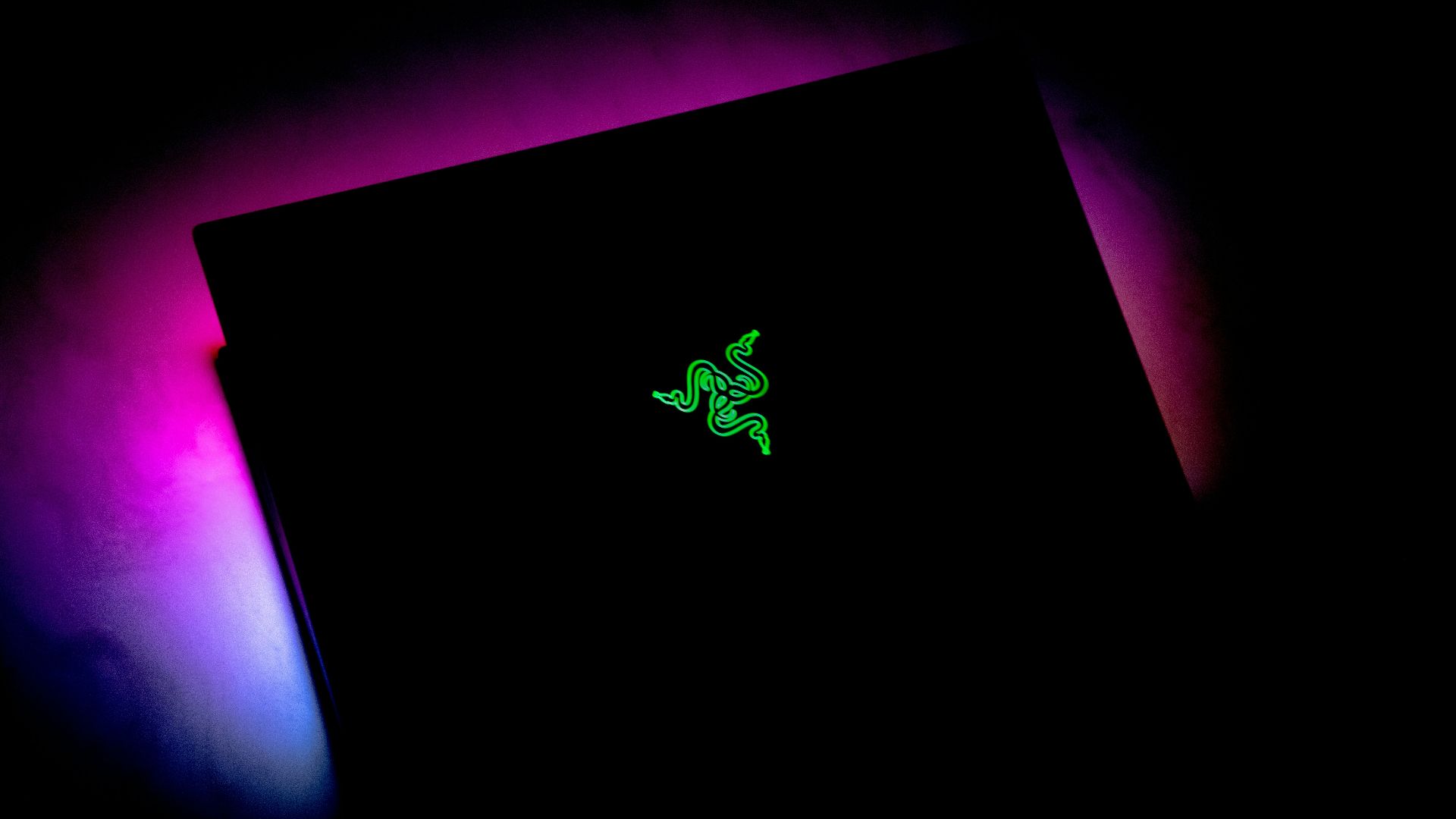 black apple device turned on in dim light