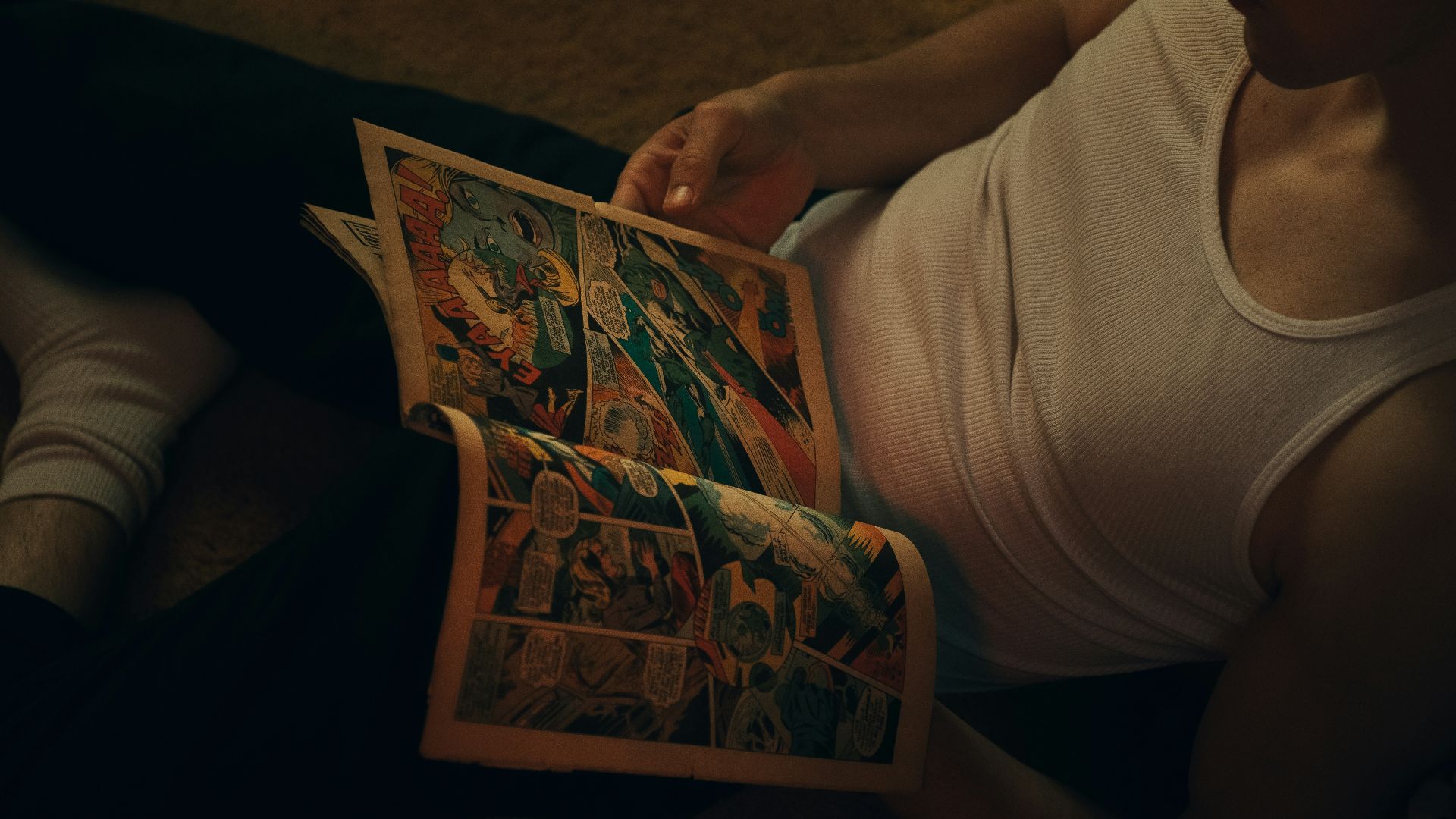 person holding a white and red book