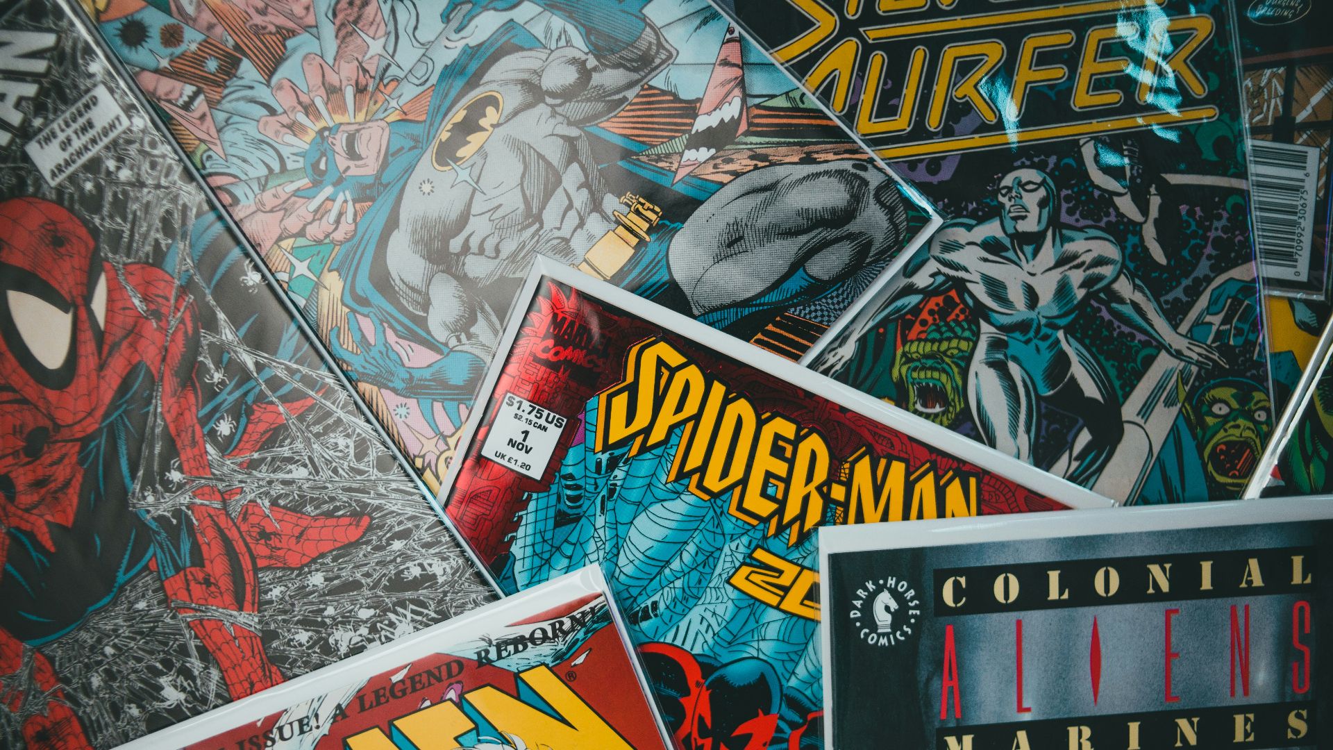 a pile of comics sitting next to each other