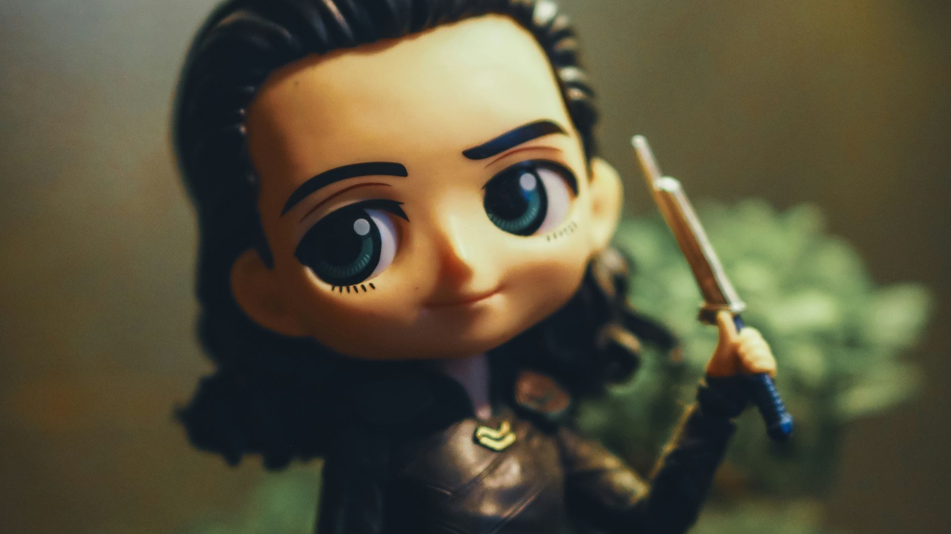a close up of a figurine of a person holding a sword