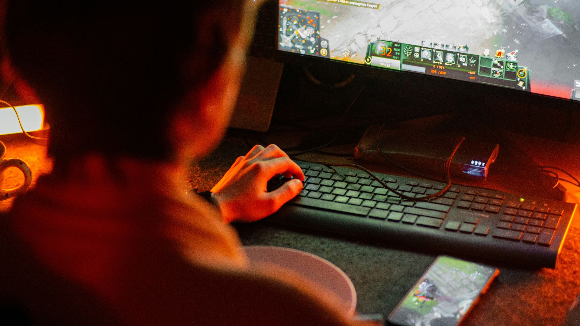 A man playing a video game on his computer