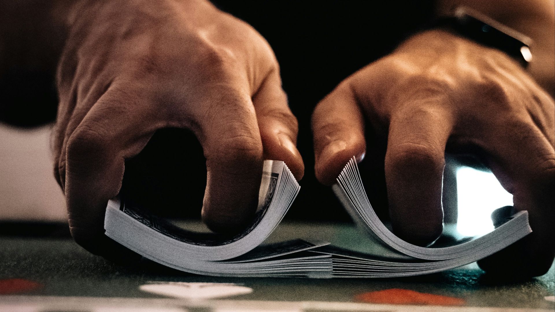 person wearing silver ring on macbook pro
