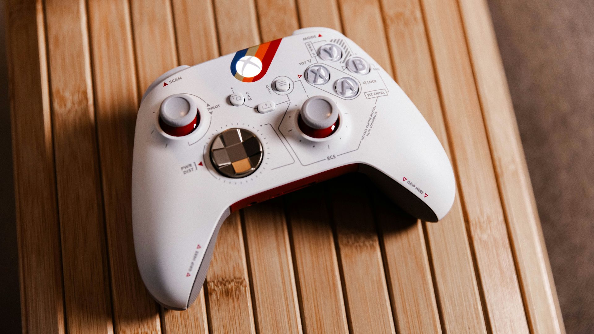 a white controller sitting on top of a wooden table