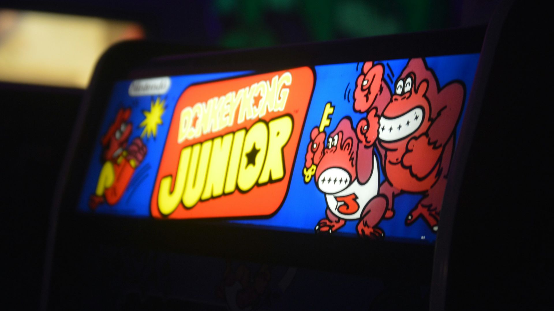 black flat screen tv turned on showing the simpsons