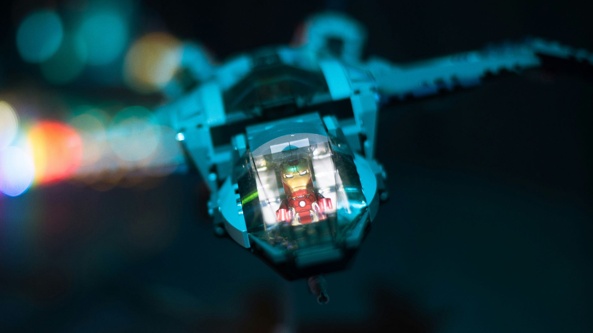 a close up of a camera with blurry lights in the background