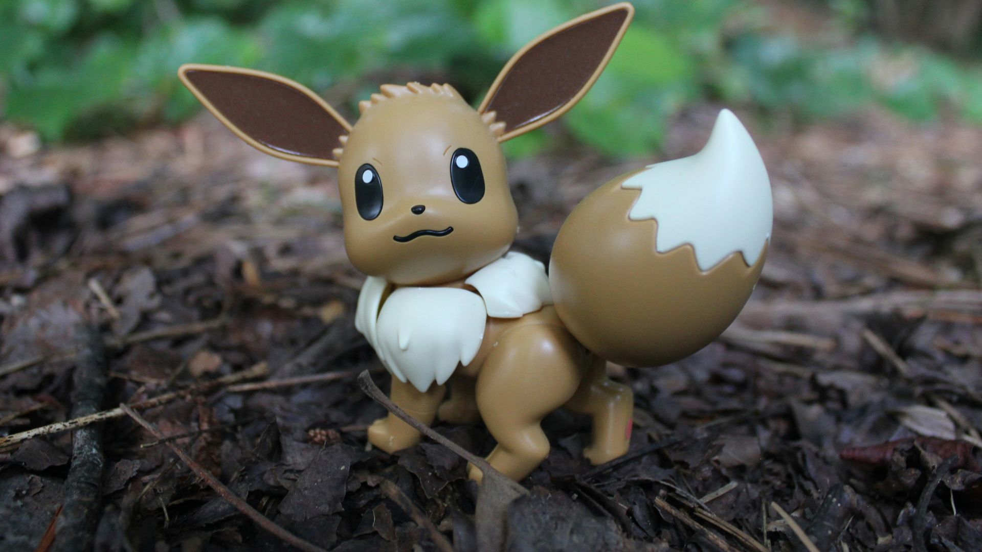 a small figurine of a pokemon sitting on the ground