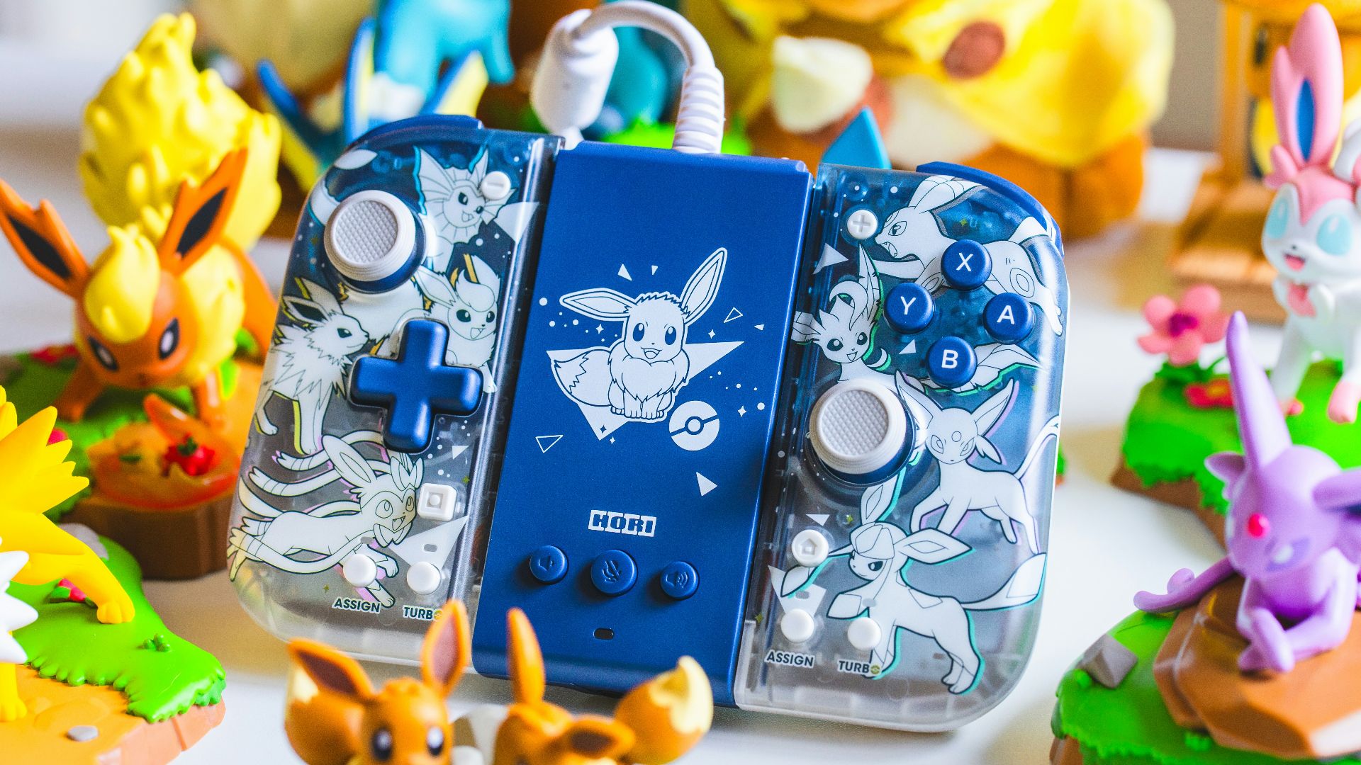 a couple of nintendo wii game controllers sitting on top of a table