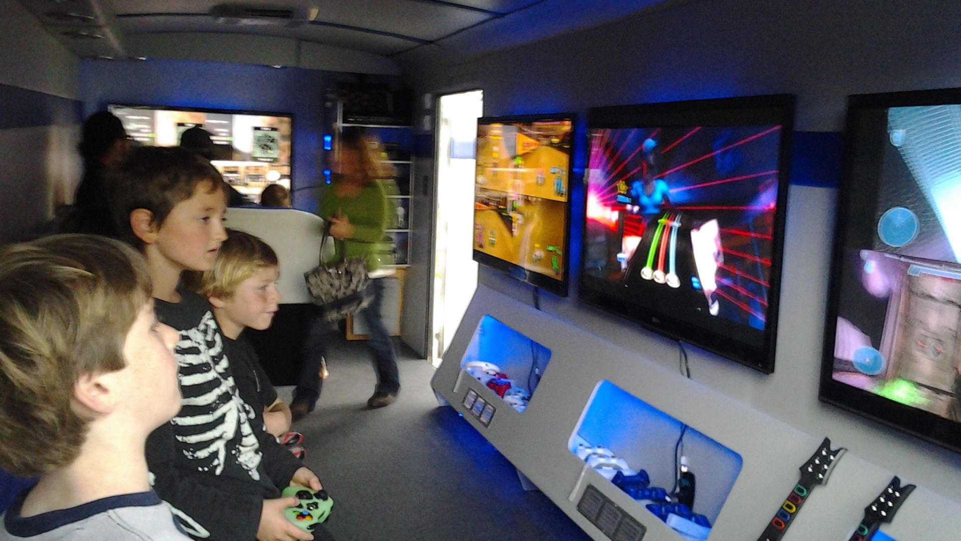 File:Children playing video games & TV's.jpg