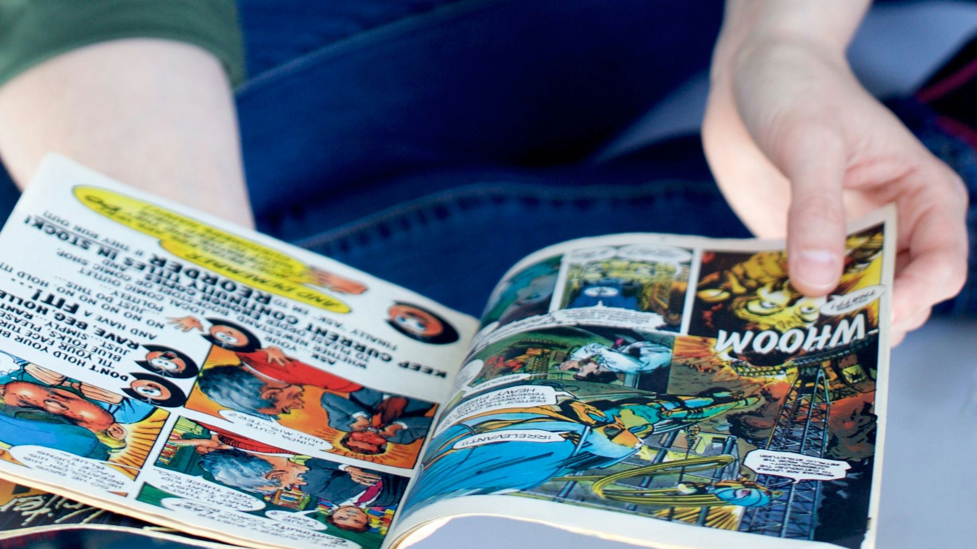 person reading comic book