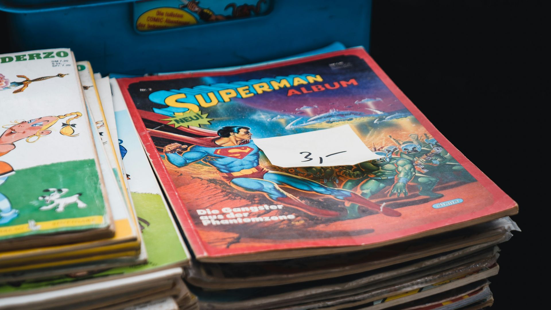 a stack of children's books sitting on top of a table