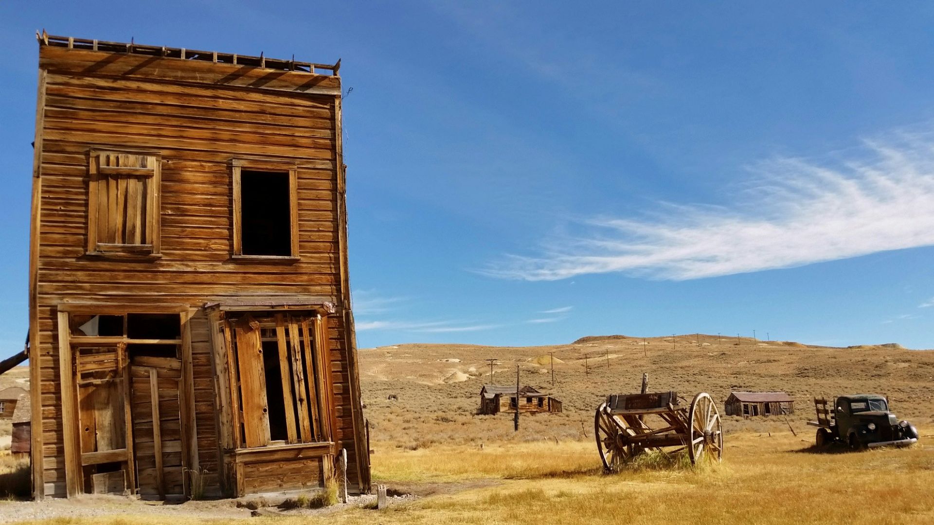 brown 2-storey house near wagon