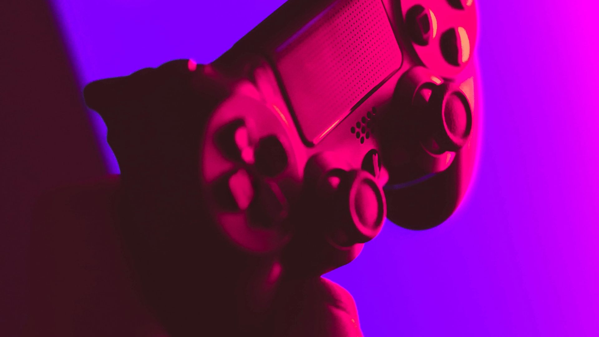 person holding black and gray game controller