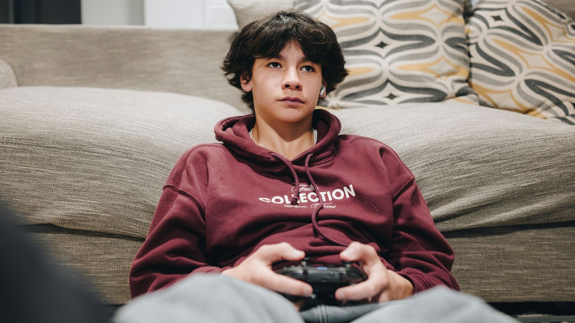 A young boy is playing a video game.