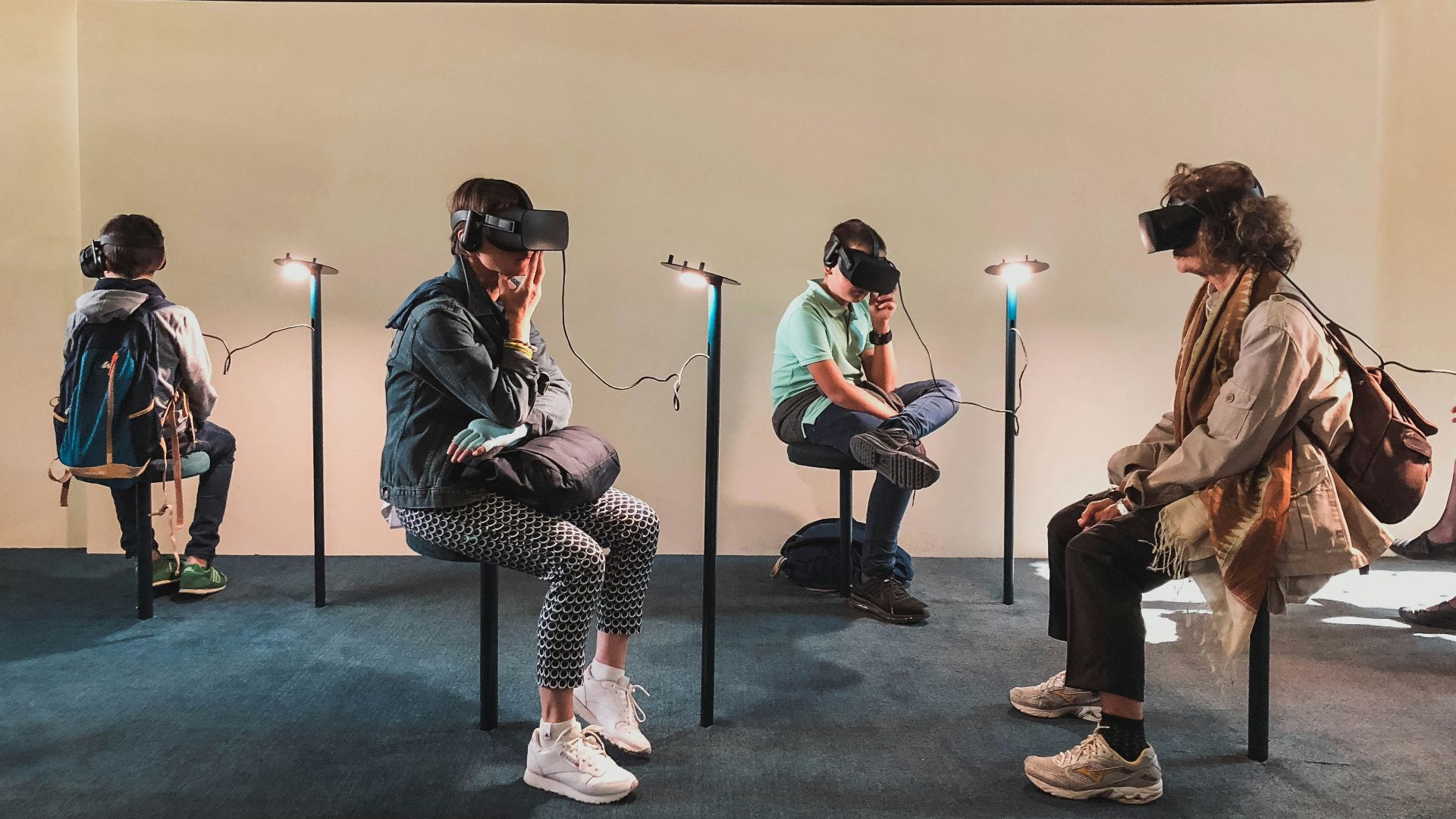 four person playing virtual reality goggles