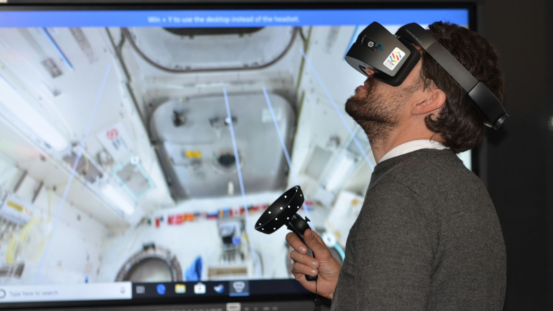 man playing VR goggles