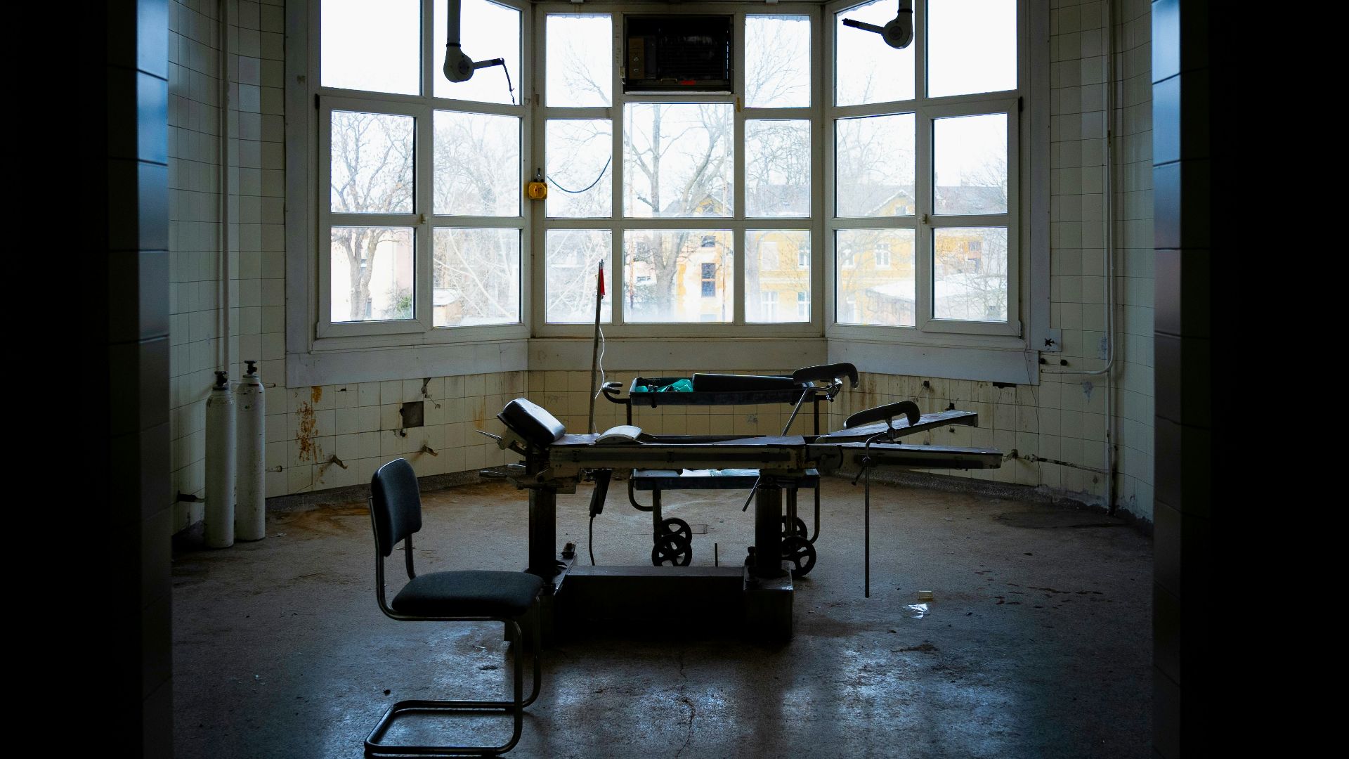 a room with a table and chairs in it